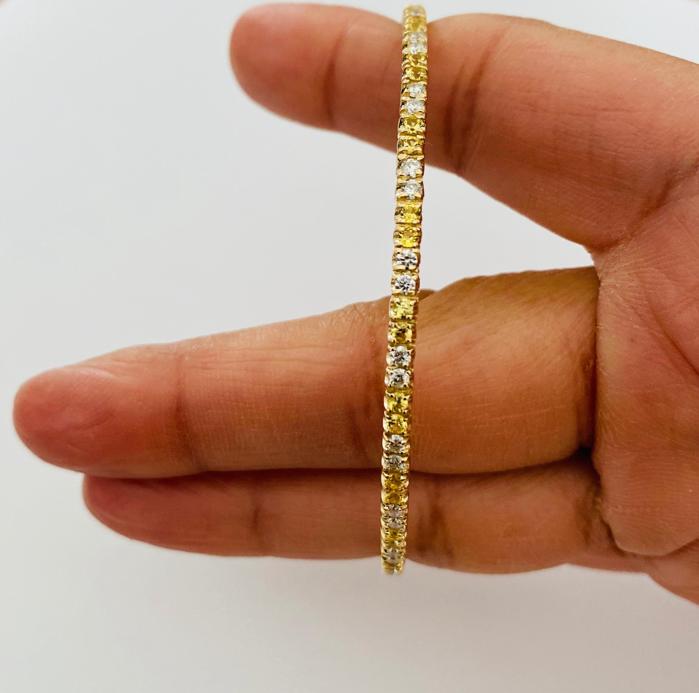 2.71 Carat Yellow Sapphire Diamond 14 Karat Yellow Gold Eternity Bangle In New Condition For Sale In Los Angeles, CA