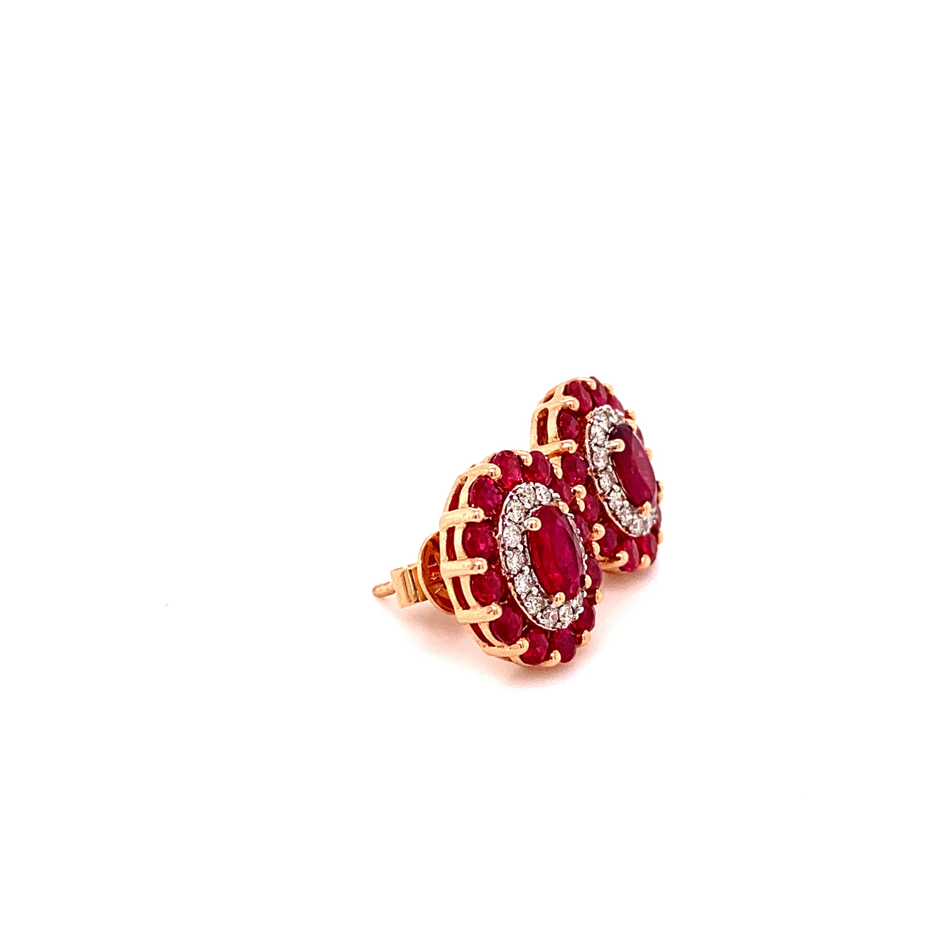 Stunning ruby diamond halo stud earrings. Lively pomegranate red, high luster, oval faceted, 2.71 carats natural rubies set high profile open basket with bead prongs, accented with round brilliant diamond row. Handcrafted elegant halo design pair of