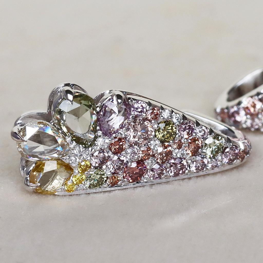 Handmade in Belgium with no casting or printing involved, these earrings are truly one of a kind. The use of high-quality materials and expert craftsmanship ensures that these earrings are of the finest quality.

The earrings are set with 2.71 ct.