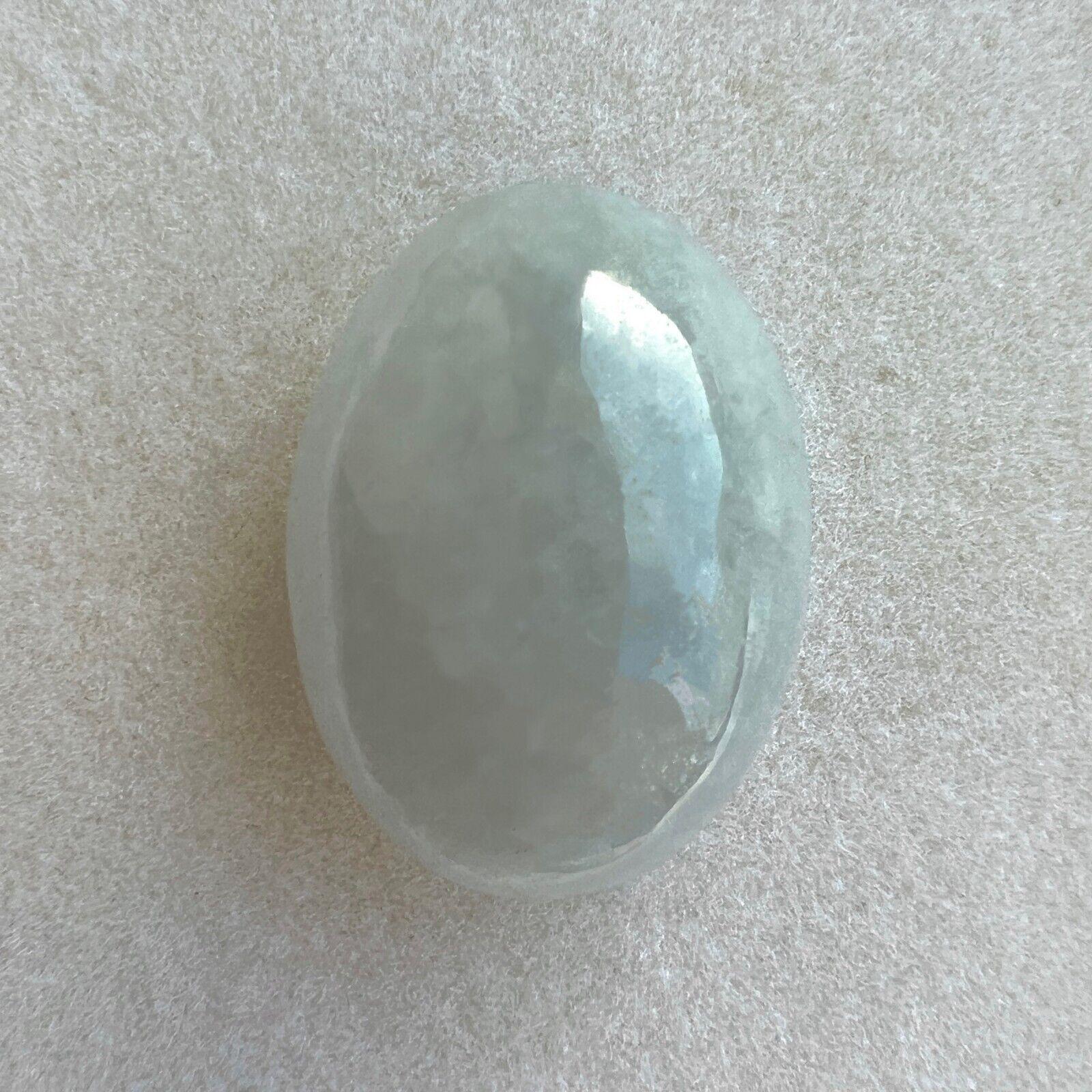 27.15Ct IGI Certified Grey White 'ice' Jadeite Jade ‘A’ Grade Cabochon Untreated

IGI Certified Untreated A Grade Grey White Jadeite Gemstone.
27.15 Carat with an excellent oval cabochon cut and grey white colour. Fully certified by IGI in