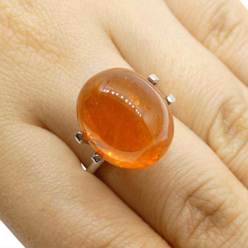Description:

Gem Type: Spessartine Garnet
Number of Stones: 1
Weight: 27.19 cts
Measurements: 16.15 x 13.10 x 11.28 mm
Shape: Oval Cabochon
Cutting Style Crown:
Cutting Style Pavilion:
Transparency: Semi-Transparent
Clarity: Slightly Included: Some