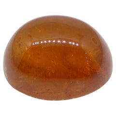 Garnet spessartine orange cabochon ovale de 27.19 carats du Nigeria