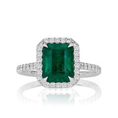 2.71ct Emerald Cut Emerald and Diamond Engagement Ring