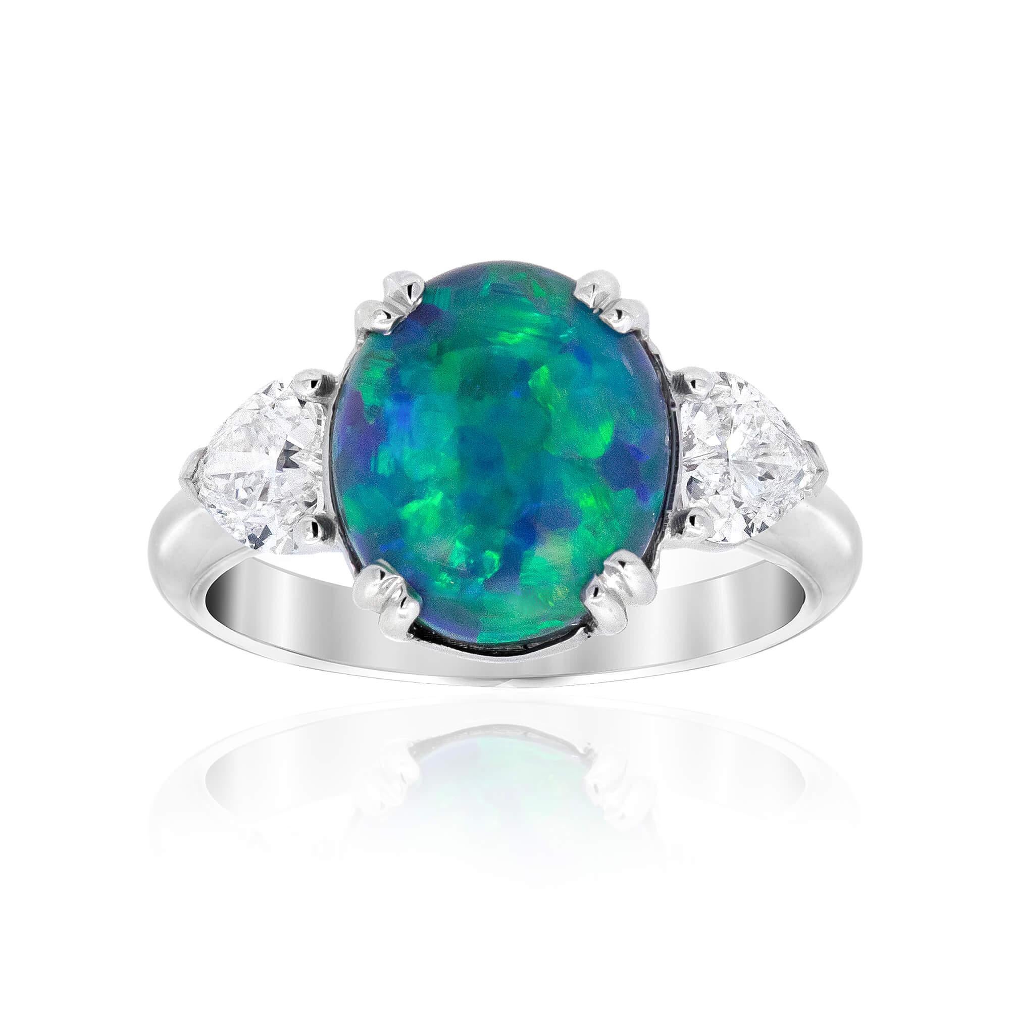 This Cherish Lightning Ridge opal and diamond three-stone ring is a perfect choice for any celebration or that special declaration of love – with a pair of heart shape diamonds providing a gorgeous accent to this phenomenal blue and green opal. The
