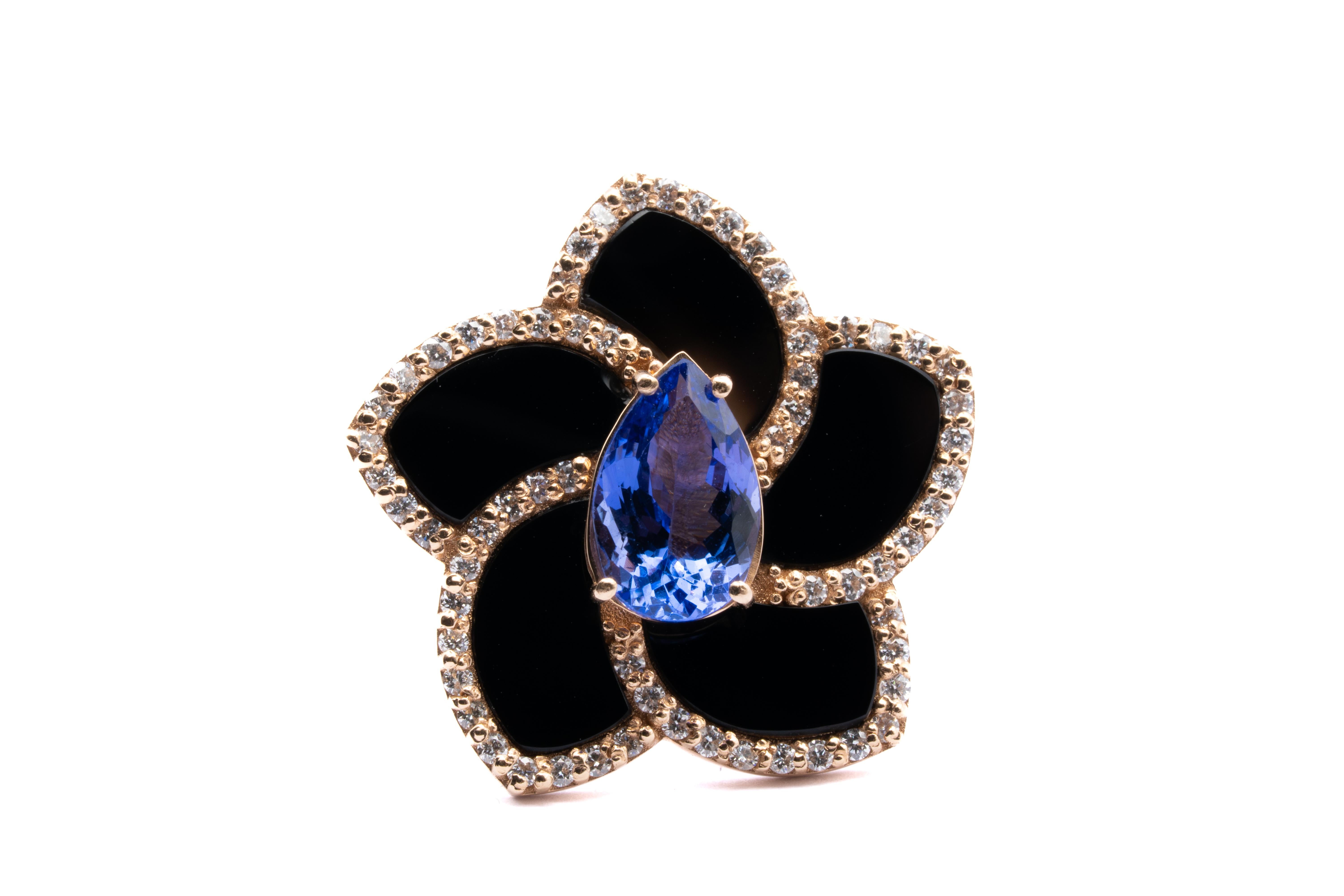 18 carat rose gold ring with onyx petals  stone and pear shape faceted tanzanite stone  Carat. 2.72 surrounded by brilliant cut diamonds with a Total weight of Carat 0.70, color G, clarity VS 1. 
any item of our jewelry collection has a dedicated