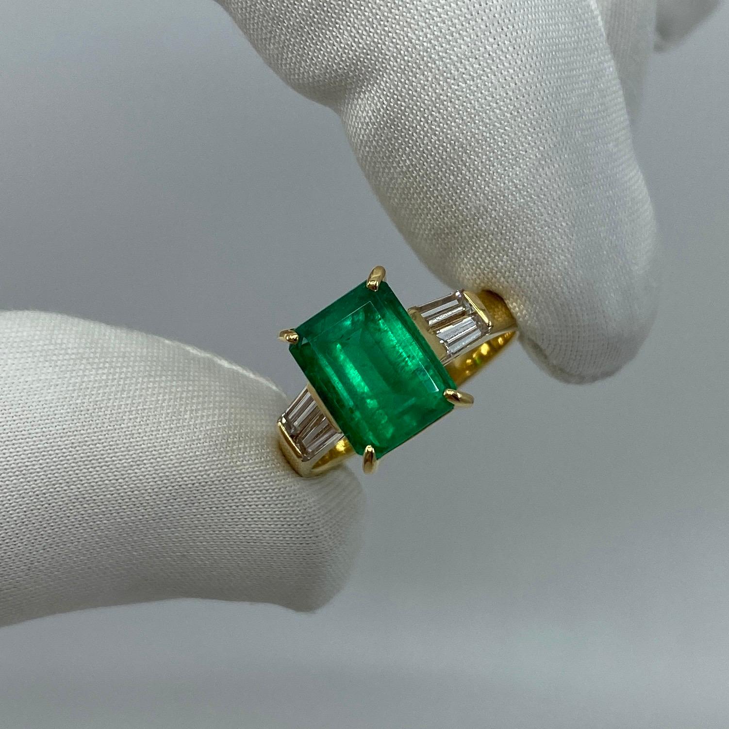 Fine Vivid Green Colombian Emerald & Diamond 18k Yellow Gold Ring.

Stunning 2.20 carat Colombian emerald with a fine vivid green colour and an excellent emerald cut. The emerald has good clarity with only some small natural inclusions visible when