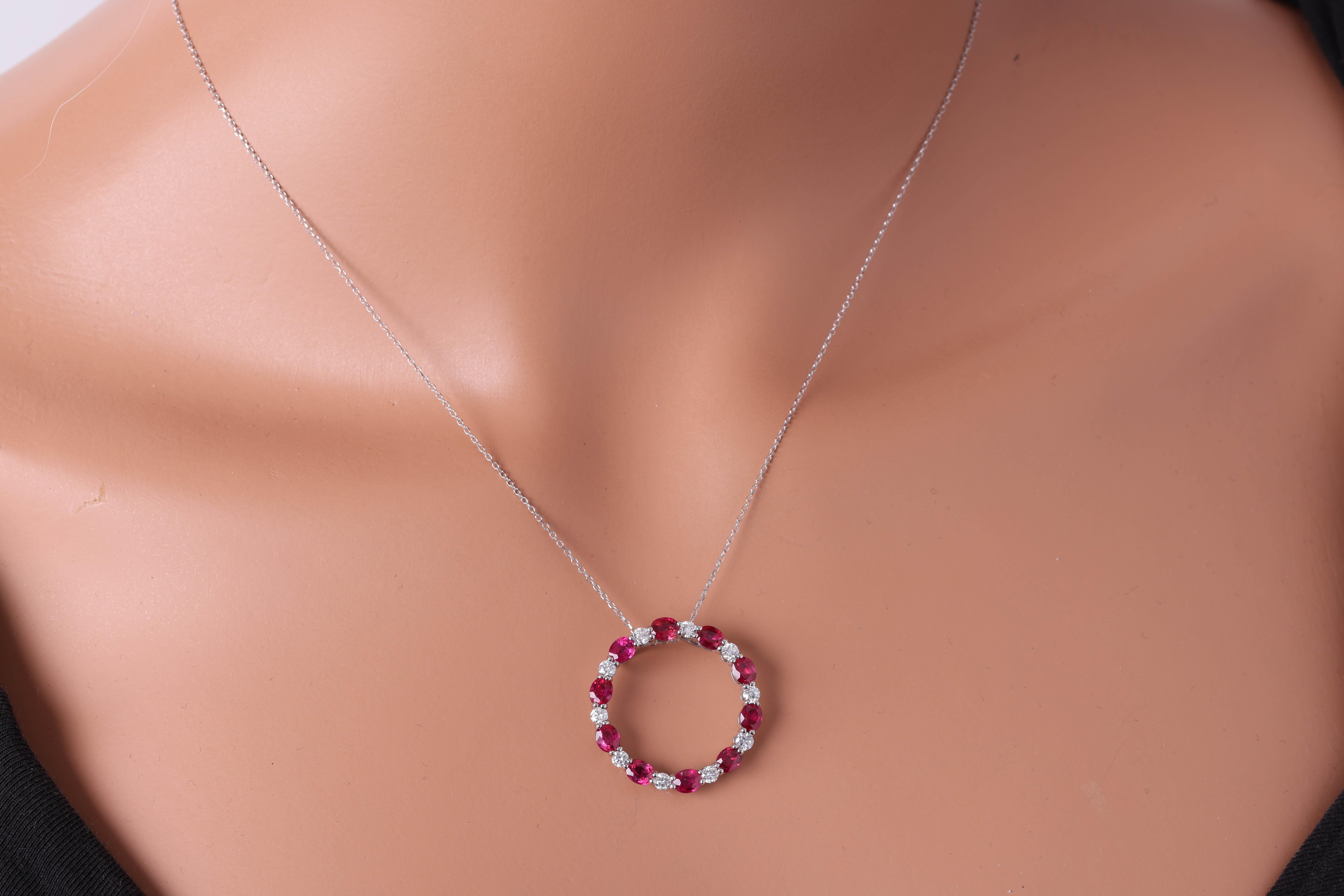 Adorn yourself with elegance and sophistication with our exquisite pendant! Crafted to captivate, this stunning piece boasts a harmonious blend of luxury and allure. Imagine ten resplendent oval cut rubies, totaling an impressive 2.72 carats,
