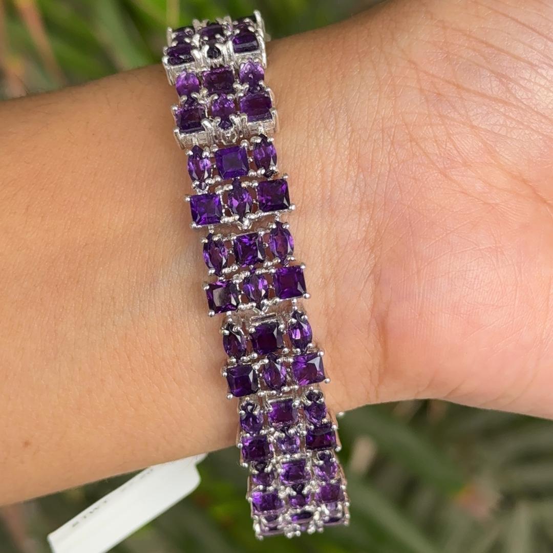 27.2 Carat Purple Amethyst Tennis Gemstone Bracelet in sterling silver showcases endlessly sparkling natural amethyst, weighing 27.2 carat. It measures 7 inches long in length.
Natural Amethyst stimulate concentration and reduces stress.
Designed