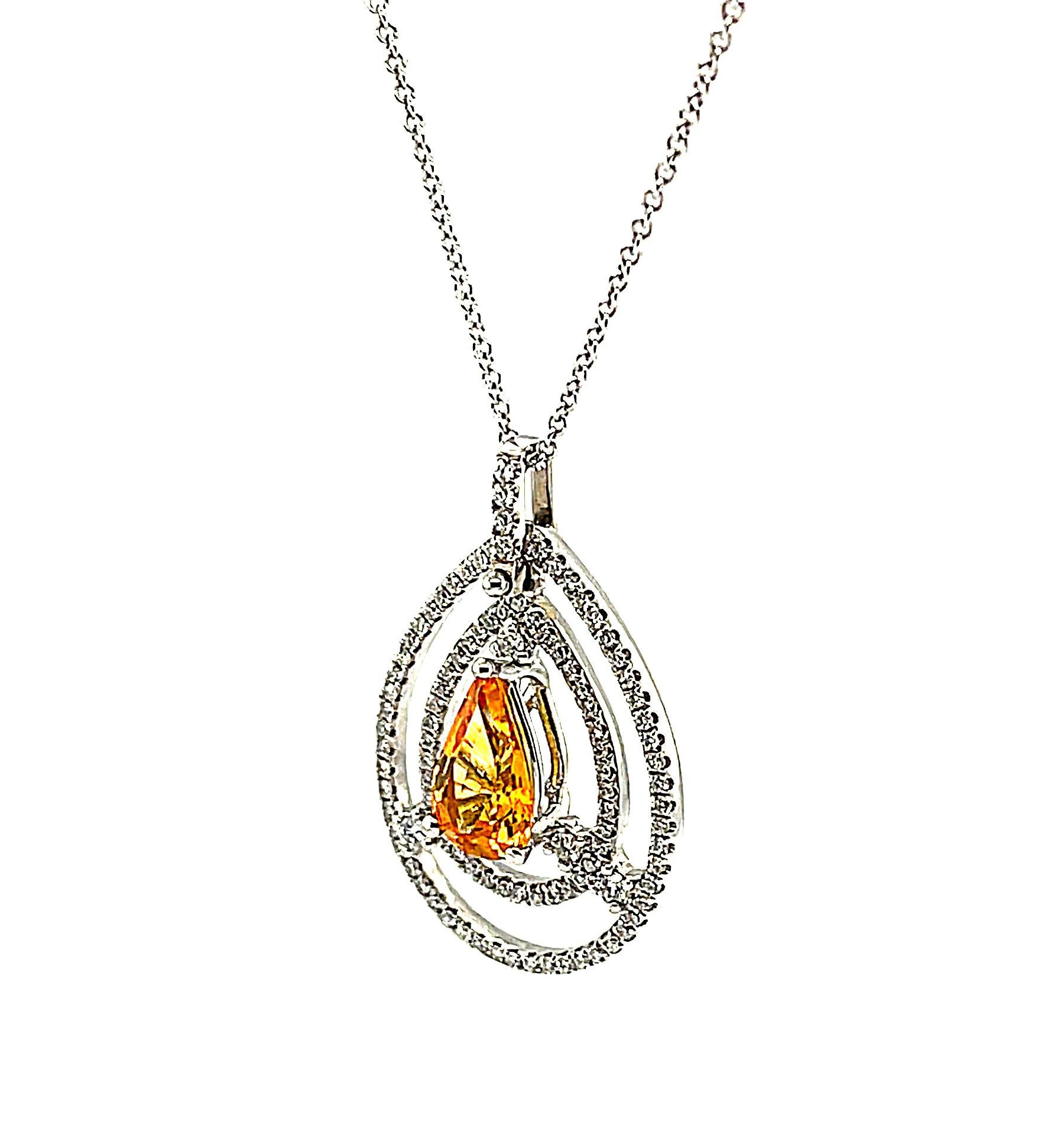 Pear Cut Yellow Sapphire and Floating Diamond Halo Pendant in Yellow Gold with Chain