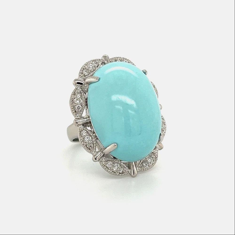 Simply Beautiful! Elegant and finely detailed Turquoise and Diamond Cocktail Ring. Centering a securely nestled Hand set Oval Cabochon Persian Turquoise weighing approx. 27.23 Carat, surrounded by Diamonds, approx. 0.45tcw. Hand crafted in Platinum.