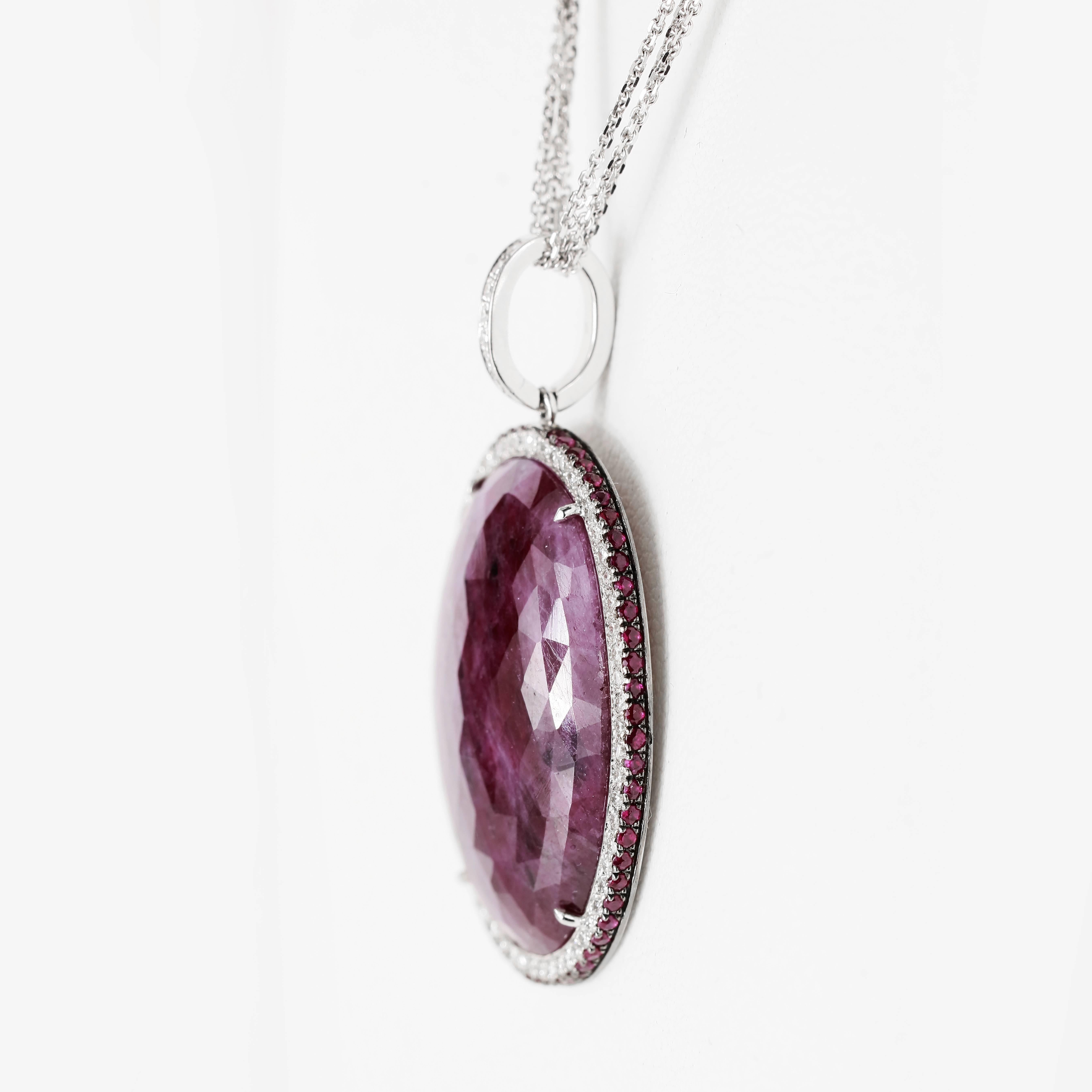 Oval Cut 27.28 Carat Oval Ruby Slice Pendant with Diamond and Ruby Halo For Sale