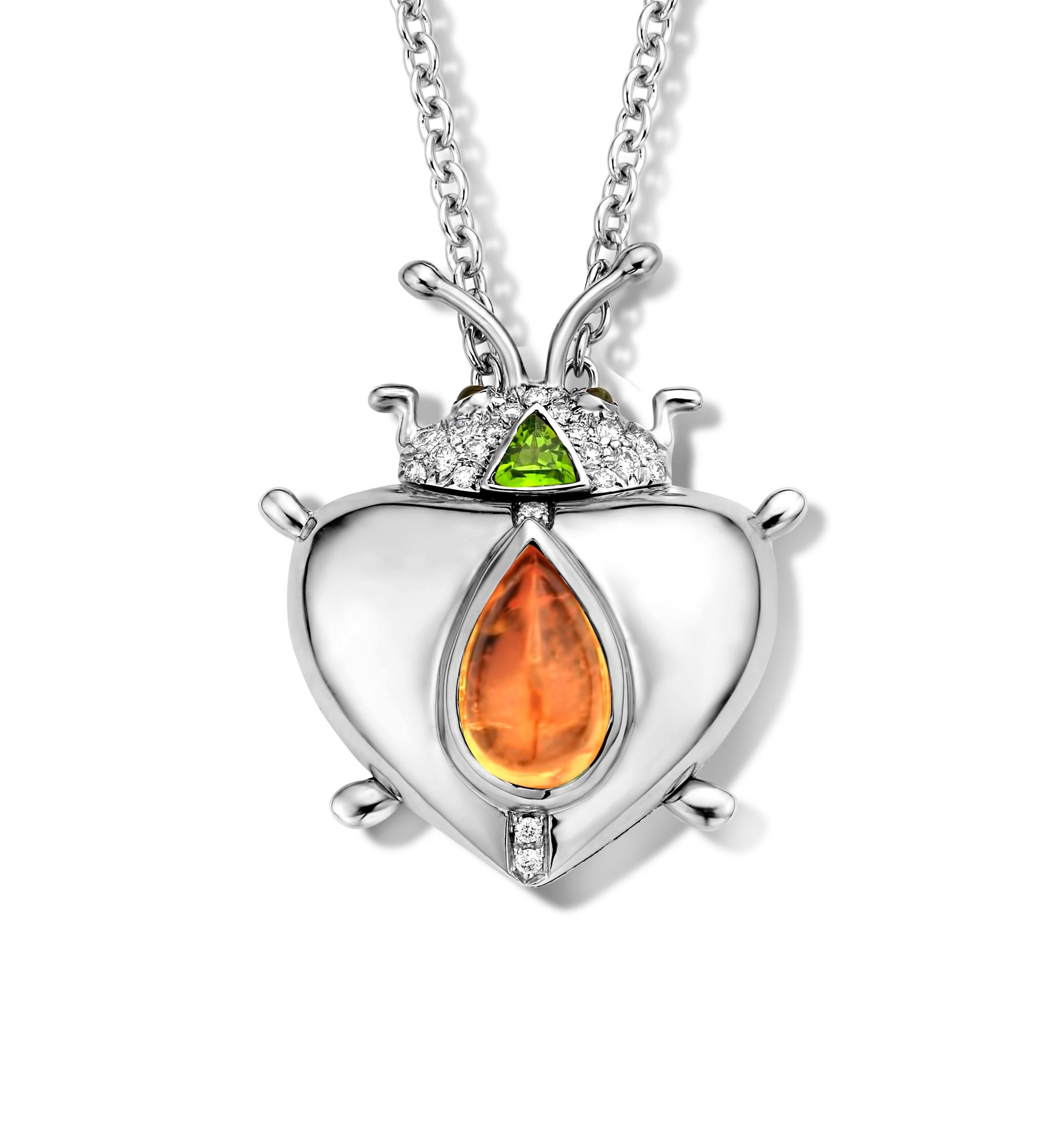 One of a kind lucky beetle necklace in 18K white gold 17,6g set with the finest diamonds in brilliant cut 0,14Ct (VVS/DEF quality) and one natural, Mandarin garnet in pear cabochon cut 2,73Ct. The head is set with a pink tourmaline in trillion cut,