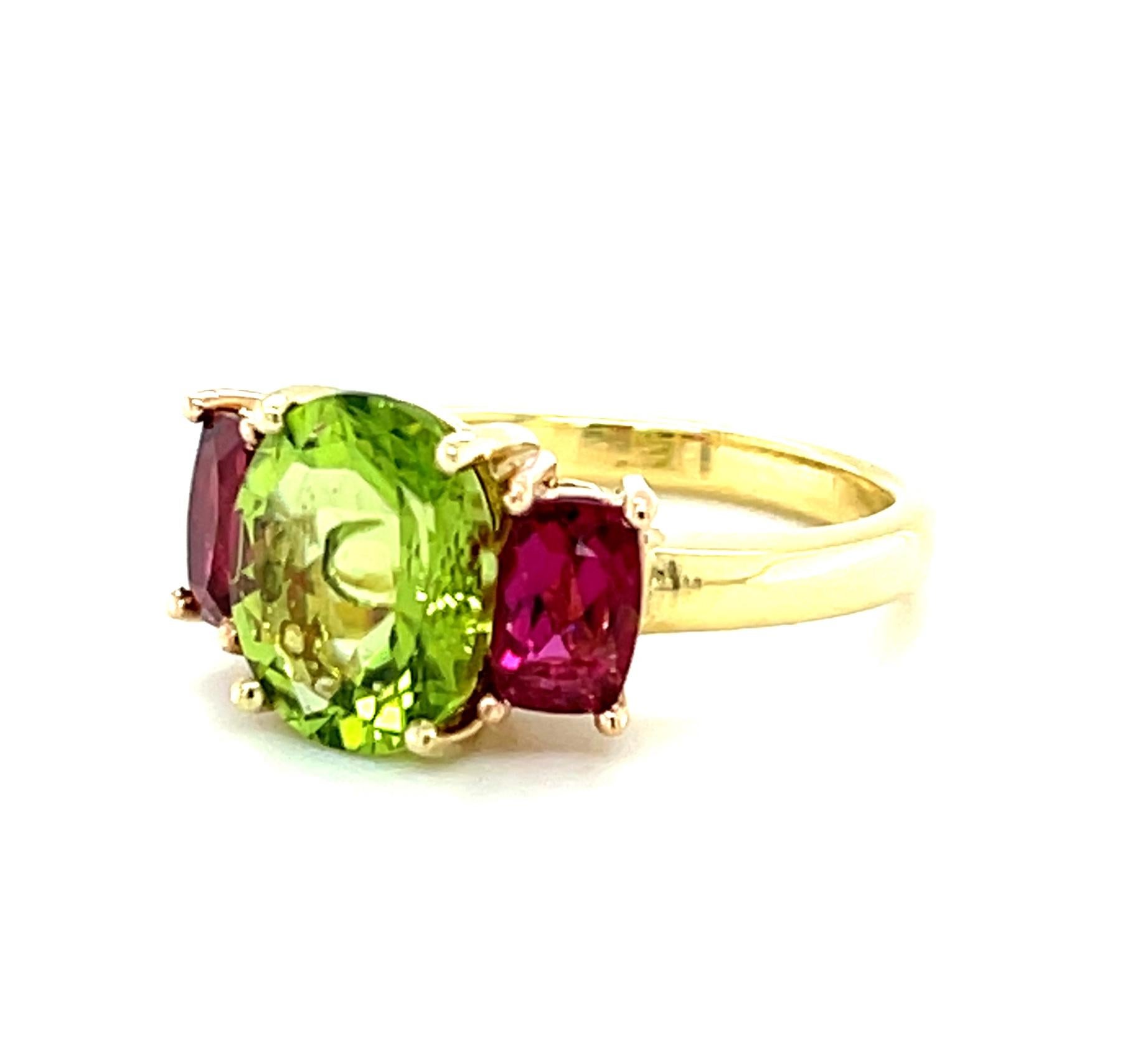 Oval Cut Peridot and Rubellite Pink Tourmaline Three-Stone Ring in Rose and Yellow Gold For Sale