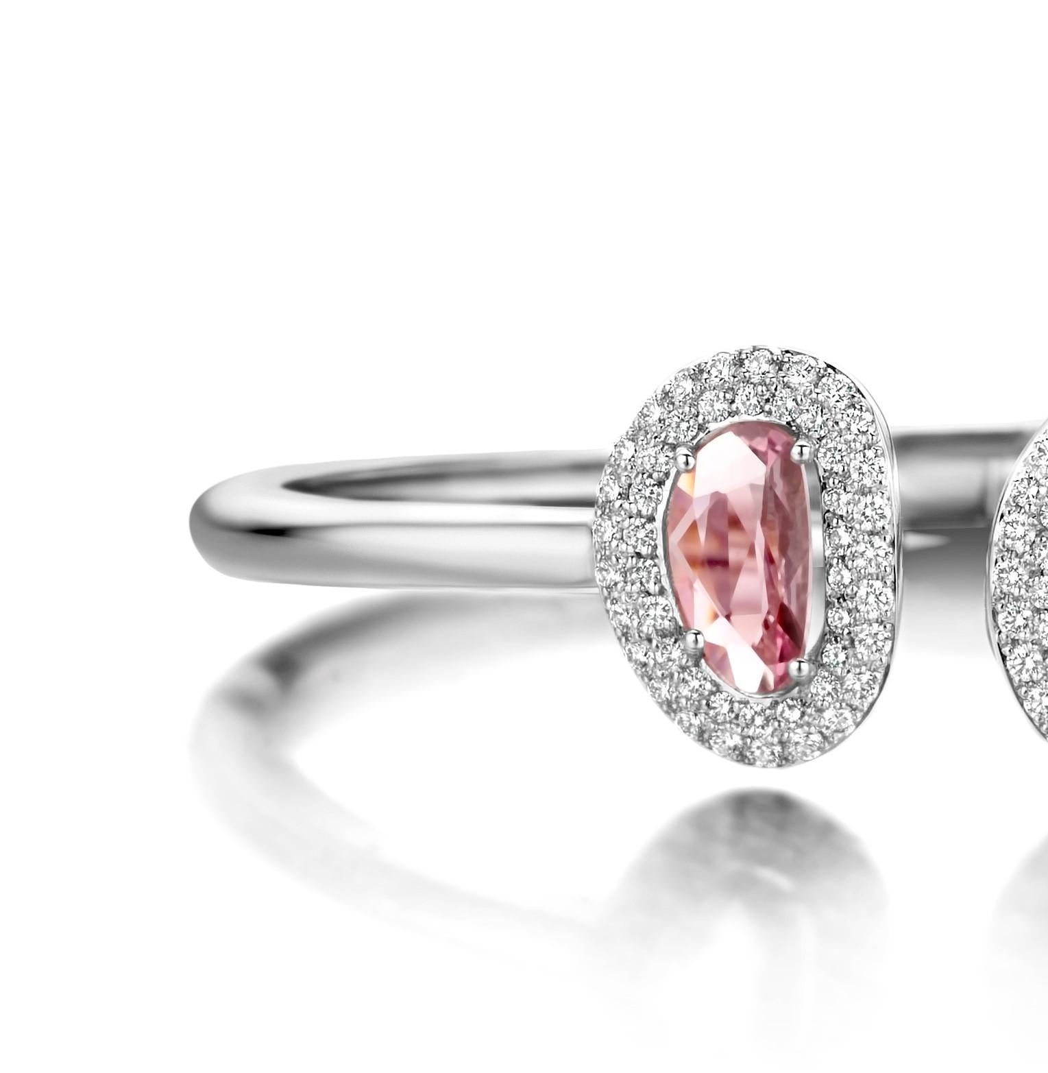 One of a kind two-stone “Didi” bangle in 18K white gold 18,5g set with the finest diamonds in brilliant cut 0,71Ct (VS/F quality), a natural pink sapphire 0,94Ct and a natural yellow sapphire 1,79Ct in double rose cut. The inner size of this bangle