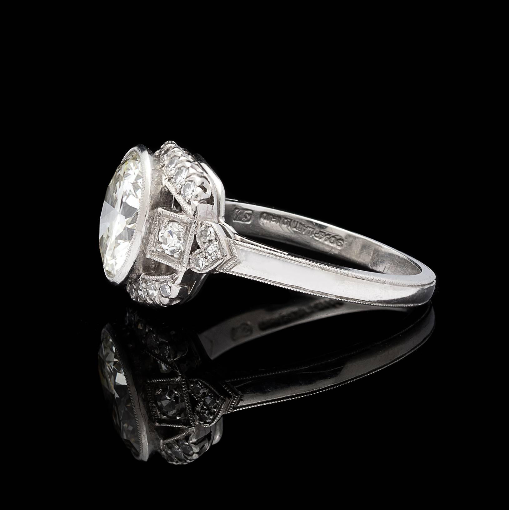 Brilliance and vintage appeal both in this stunner of a ring. Featuring a bezel-set round brilliant-cut diamond weighing 2.73 carats (K-L/VS), set with a tonneau-shaped mount, accented with 24 single-cut diamonds, with an estimated total diamond