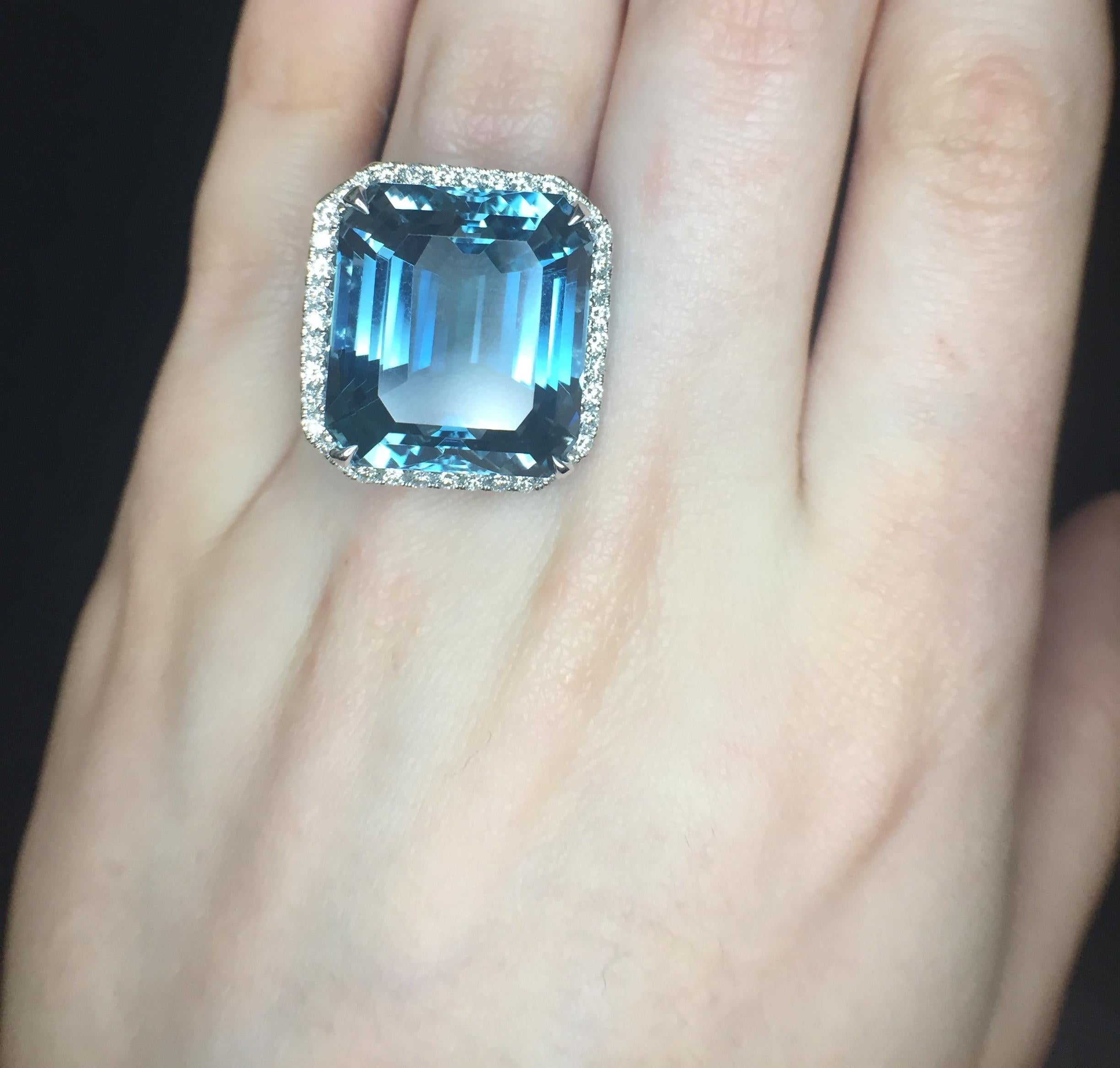 27.30ct Aquamarine (GIA report) emerald cut, very fine Santa Maria color, set in an 18k white gold cocktail ring with 2.50 total diamond weight. Ring size 6.5, can be sized larger or smaller upon request.
Aquamarine measurements: