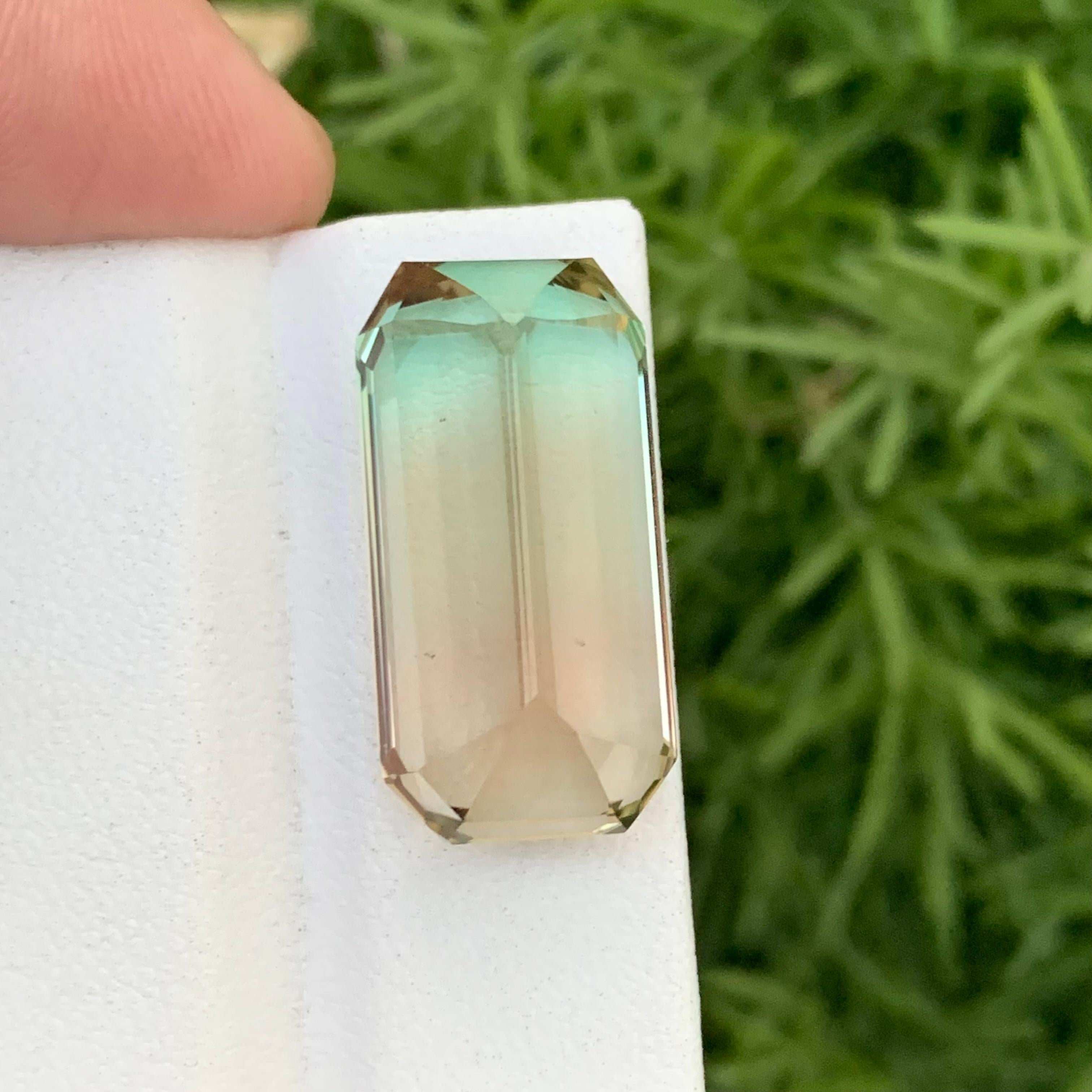 Loose Bicolor Tourmaline 
Weight: 27.35 Carats 
Dimension: 24X12X10.7 Mm
Origin: Kunar Afghanistan 
Shape: Emerald 
Color: Green & Peach Yellow
Treatment: Non
Certificate: On Customer Demand 
Bi-color Tourmaline, a fascinating member of the