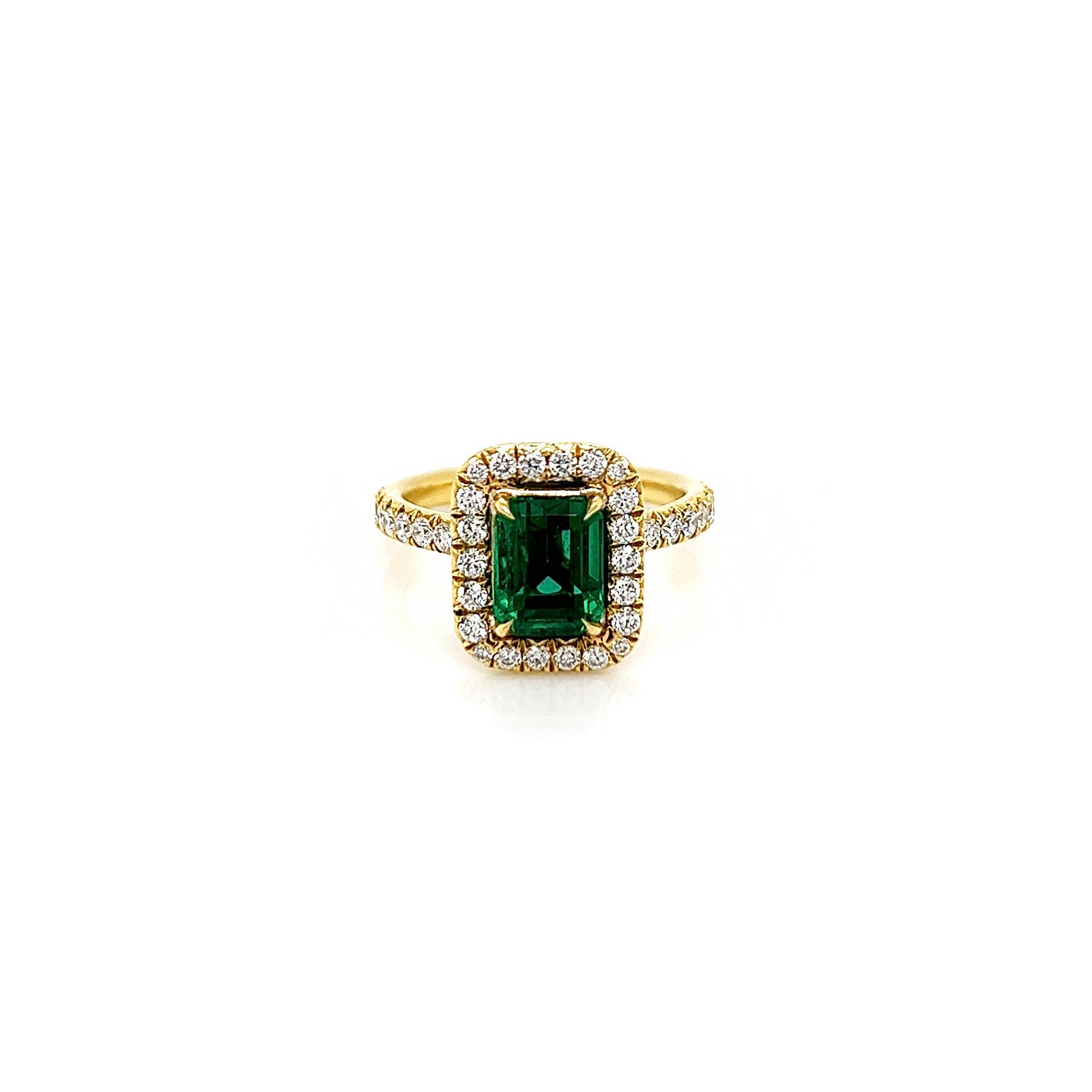 2.73 Total Carat Emerald and Diamond Halo Ladies Engagement Ring GIA

-Metal Type: 18K Yellow Gold
-1.72 Carat, Emerald Cut Natural Colombian Beryl Emerald, GIA Certified
-Emerald Color: Green
-1.01 Carat Round Natural side Diamonds. F-G Color,