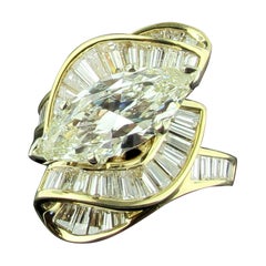 2.74 Carat Marquise Set in 14 Karat Yellow Gold and 68 Baguettes