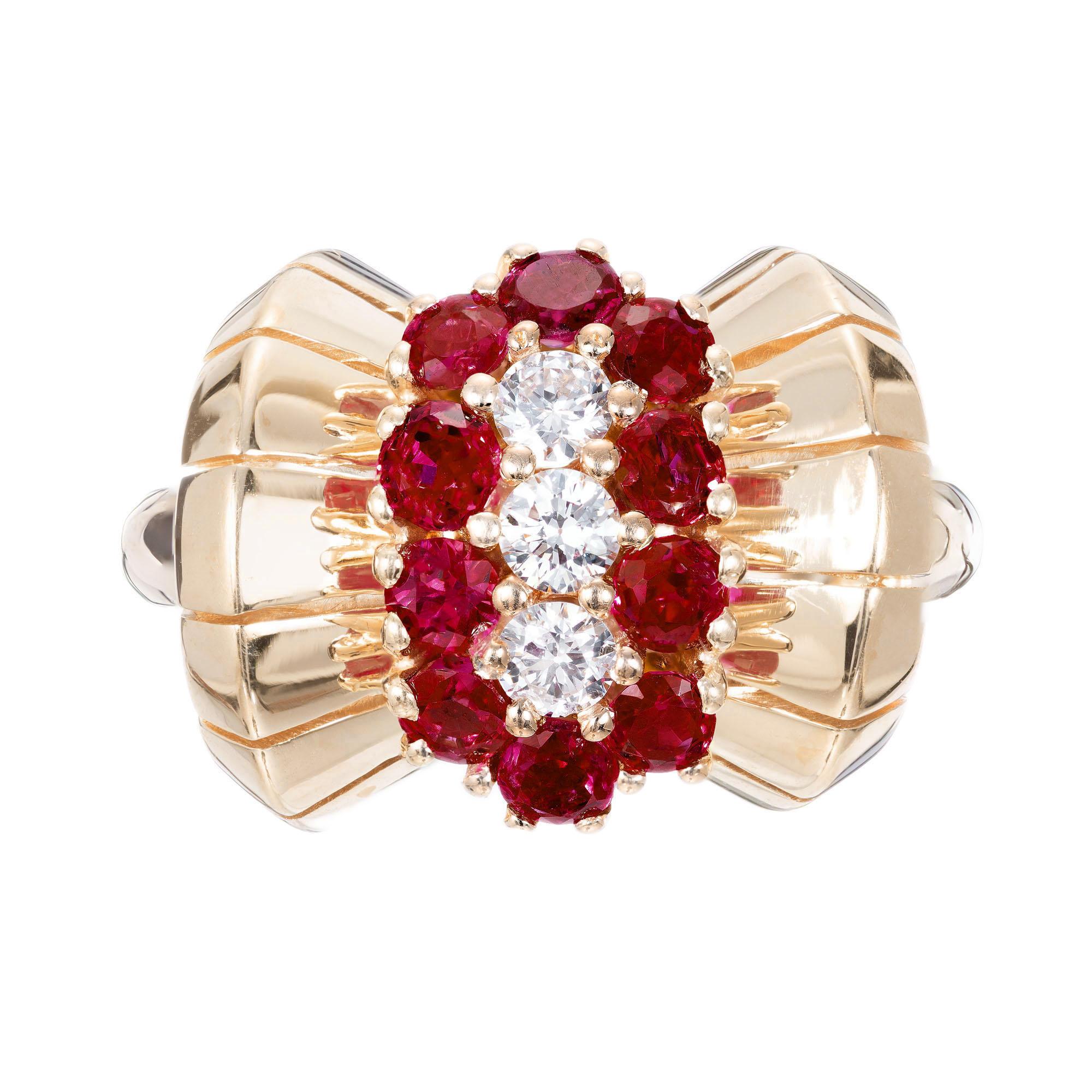 Circa 1930's round ruby and diamond 14k yellow gold bow style cocktail ring. 

3 full cut diamonds, approx. total weight .24cts, F, VS
10 2.5mm genuine Rubies, approx. total weight 2.50ct, gem bright red
Size 5+ and sizable
14k Yellow Gold
7.0
