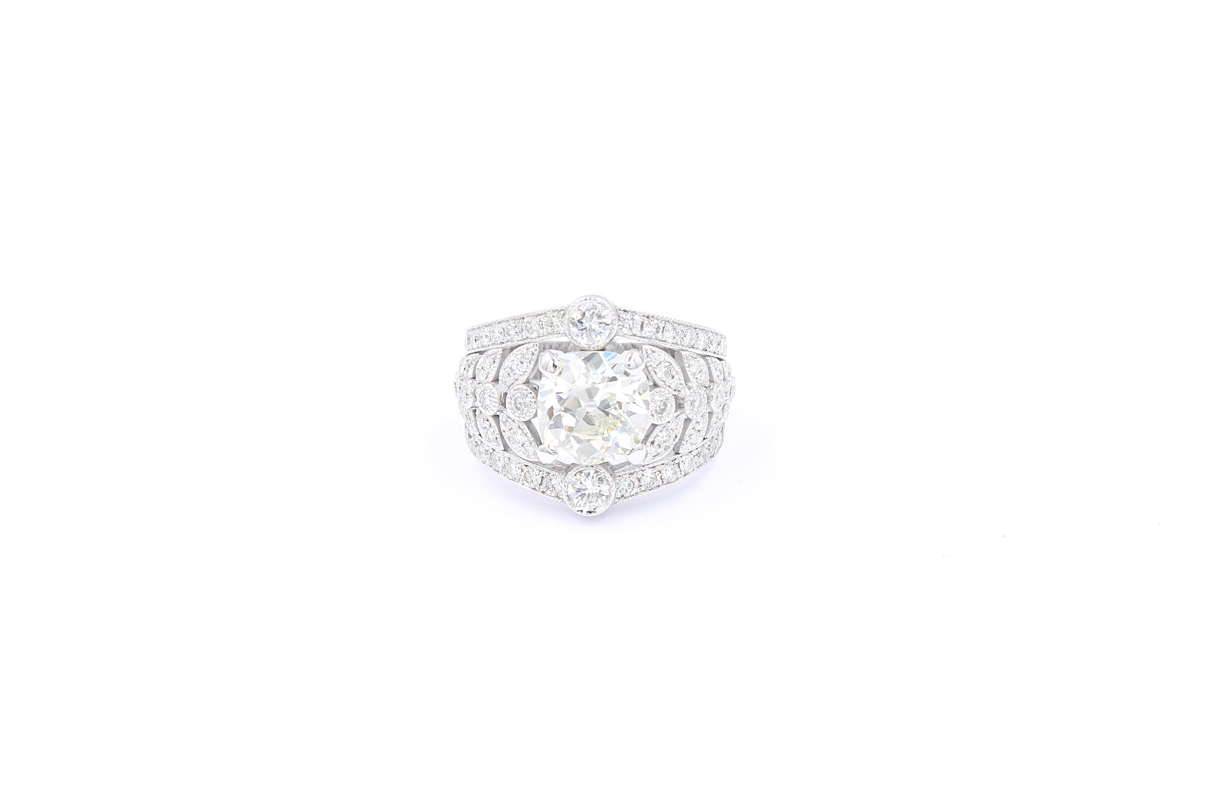 Ring made of white gold 18K set with a center 2.74 Carats old mine natural diamond (estimated J/K color - Vs clarity)  surrounded by 88 diamonds for a total of  1.20 Carats brilliant diamonds (G /H color - Vs clarity). 

The ring have been made by