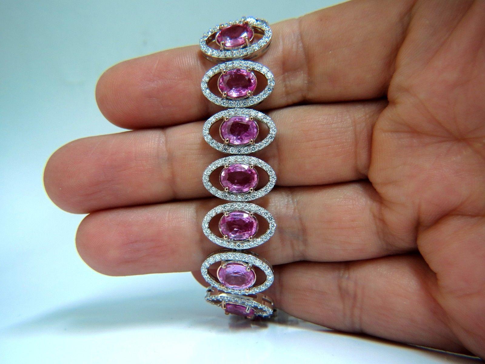 Posh Pinks & Halo.

23.35ct. Natural Pink Sapphires

 & 4.12ct Diamonds bracelet.

Full Oval cuts, great sparkle.

Average Each: 6 X 8mm

Clean Clarity & Transparent.

Vivid Pinks and Prime Saturation.

Round Brilliant Diamonds: G-color Vs-2