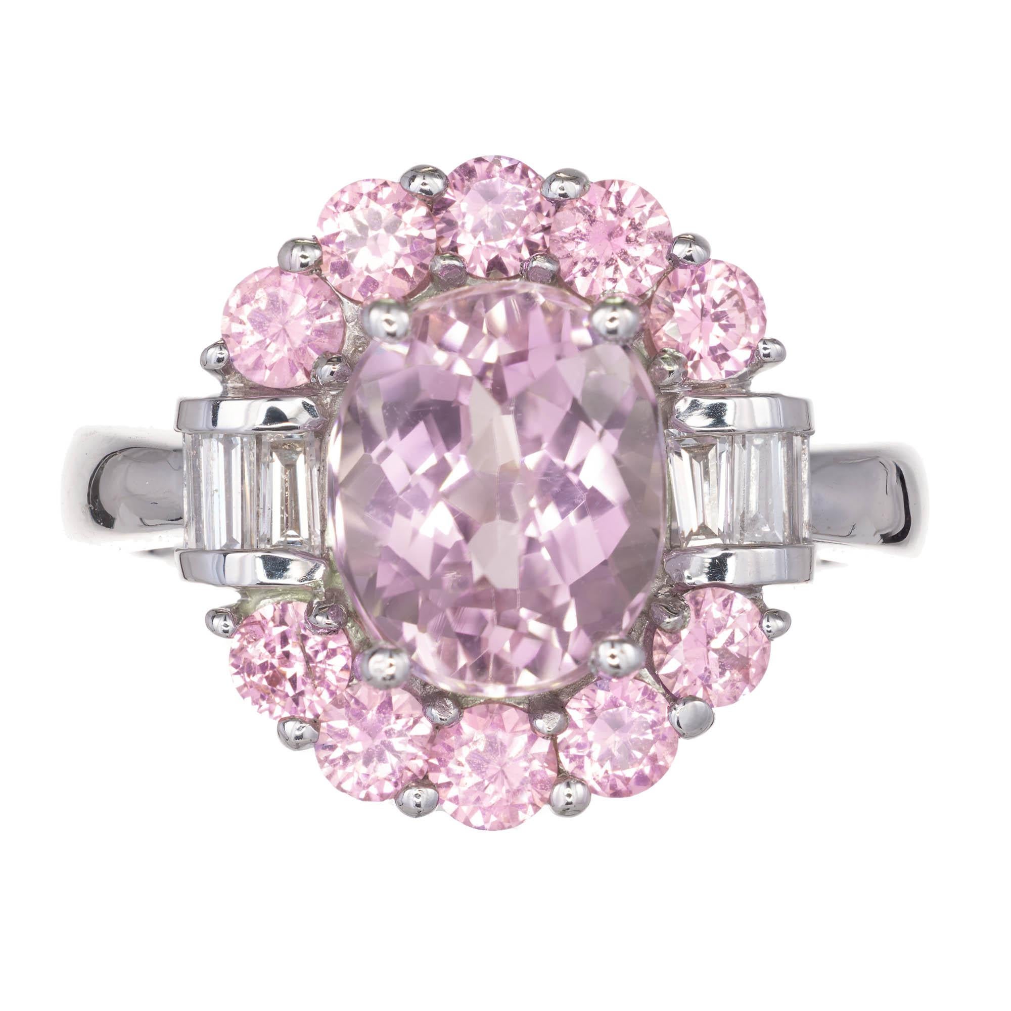 Light lavender oval faceted Amethyst set with round pink sapphires above and below by baguette diamonds in a 14k white gold setting.

1 oval pale amethyst Approximate 2.75 carats
10 round pink sapphires Approximate 1.50 carats
6 baguette G-H VS