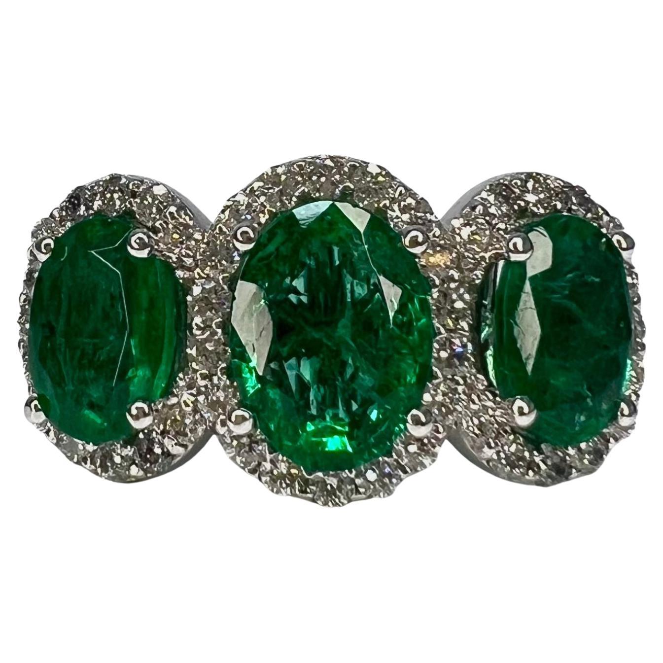 2.75 Carat Emerald Three Stone Halo Ring For Sale