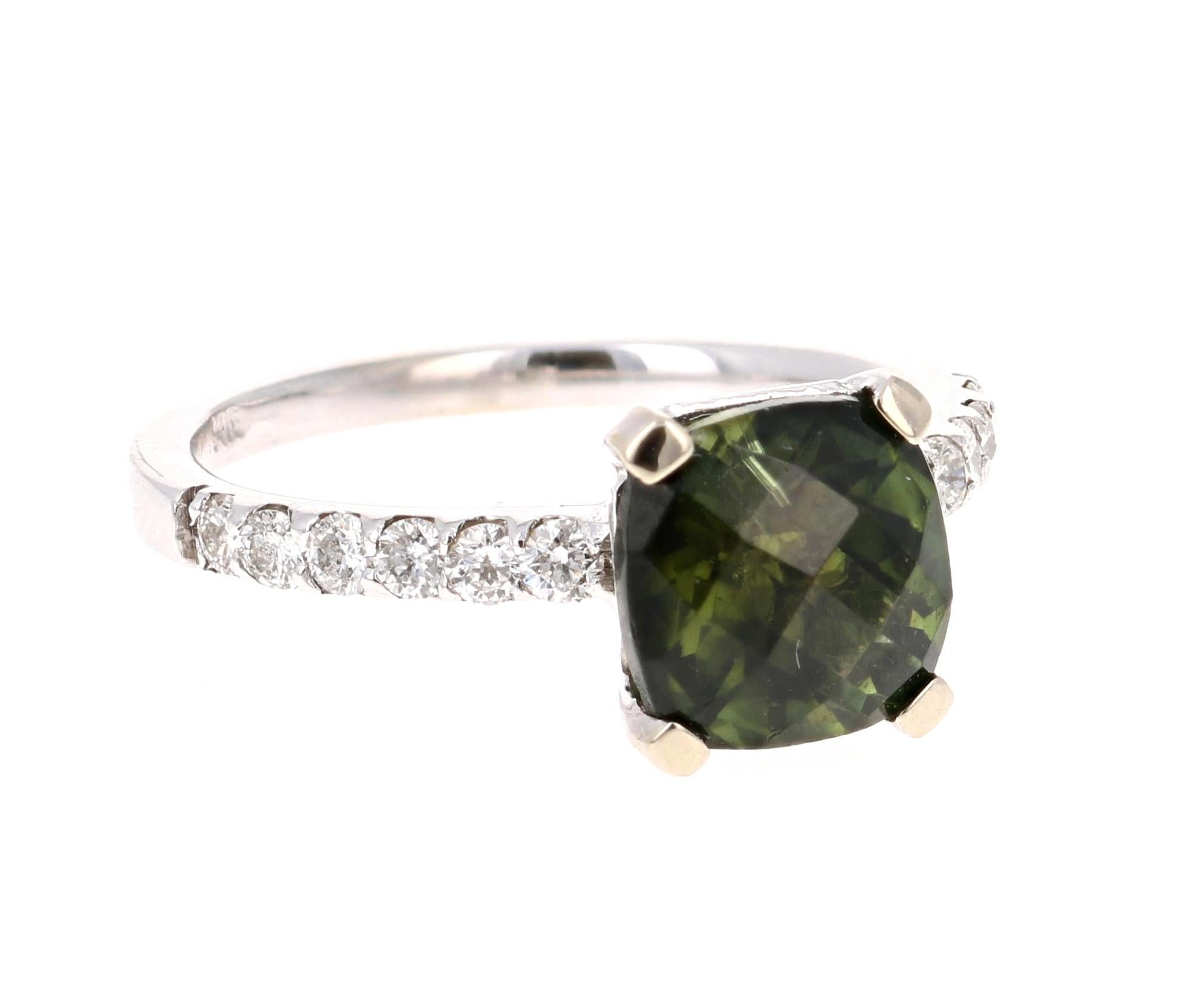 A beautiful classic setting that is sure to be a great addition to your accessory collection! 

This stunner has a Cushion Cut Green Tourmaline that weighs 2.40 Carats. Adjacent to the tourmaline are 12 Round Cut Diamonds weighing 0.35 Carats.  The