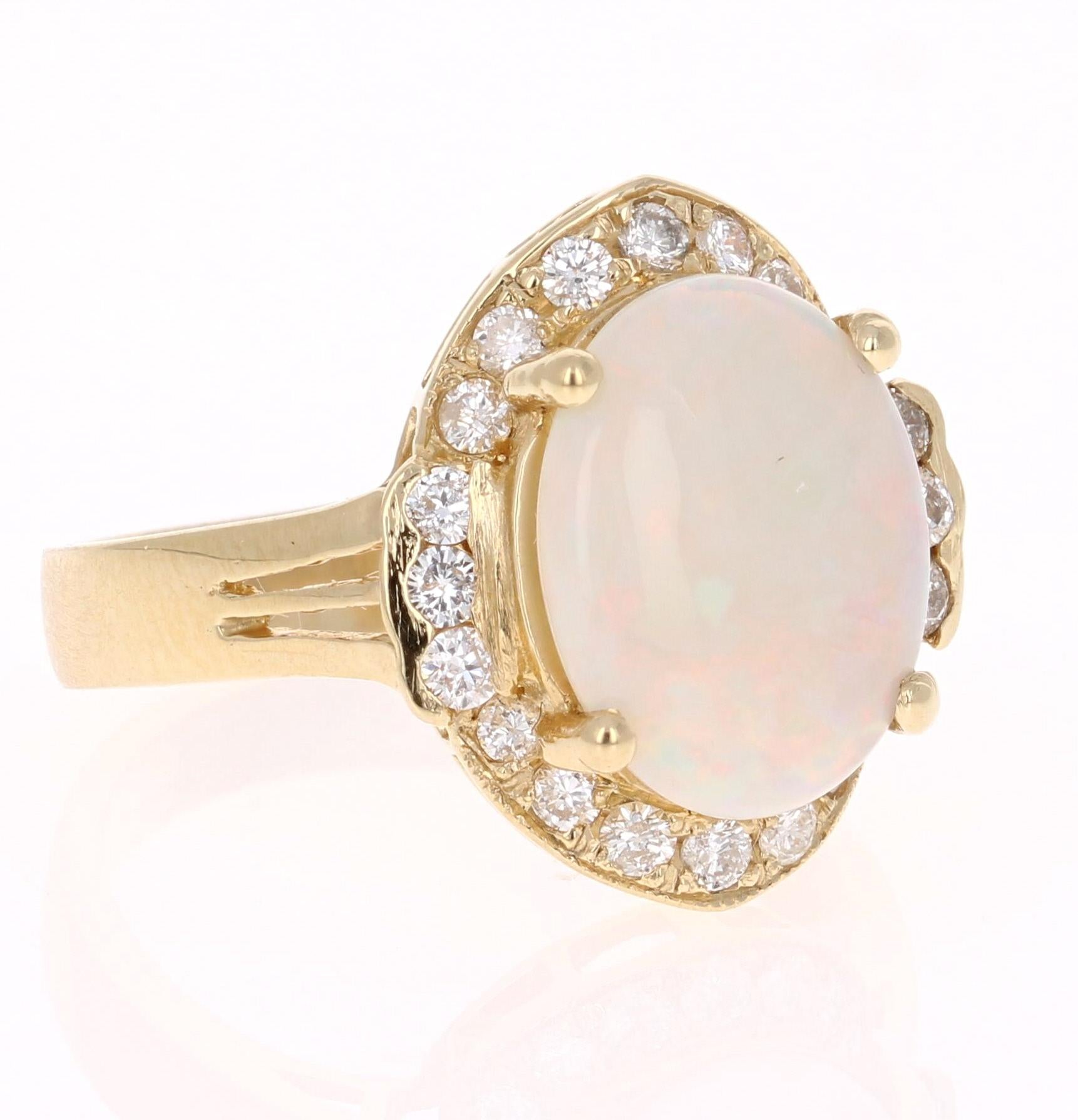 If you are on Opal lover, this ring is the perfect addition to your accessory collection!
This ring has a Oval Cut Opal that weighs 2.29 carats and is surrounded by 20 Round Cut Diamonds that weigh 0.46 carat.  The total carat weight of this ring is