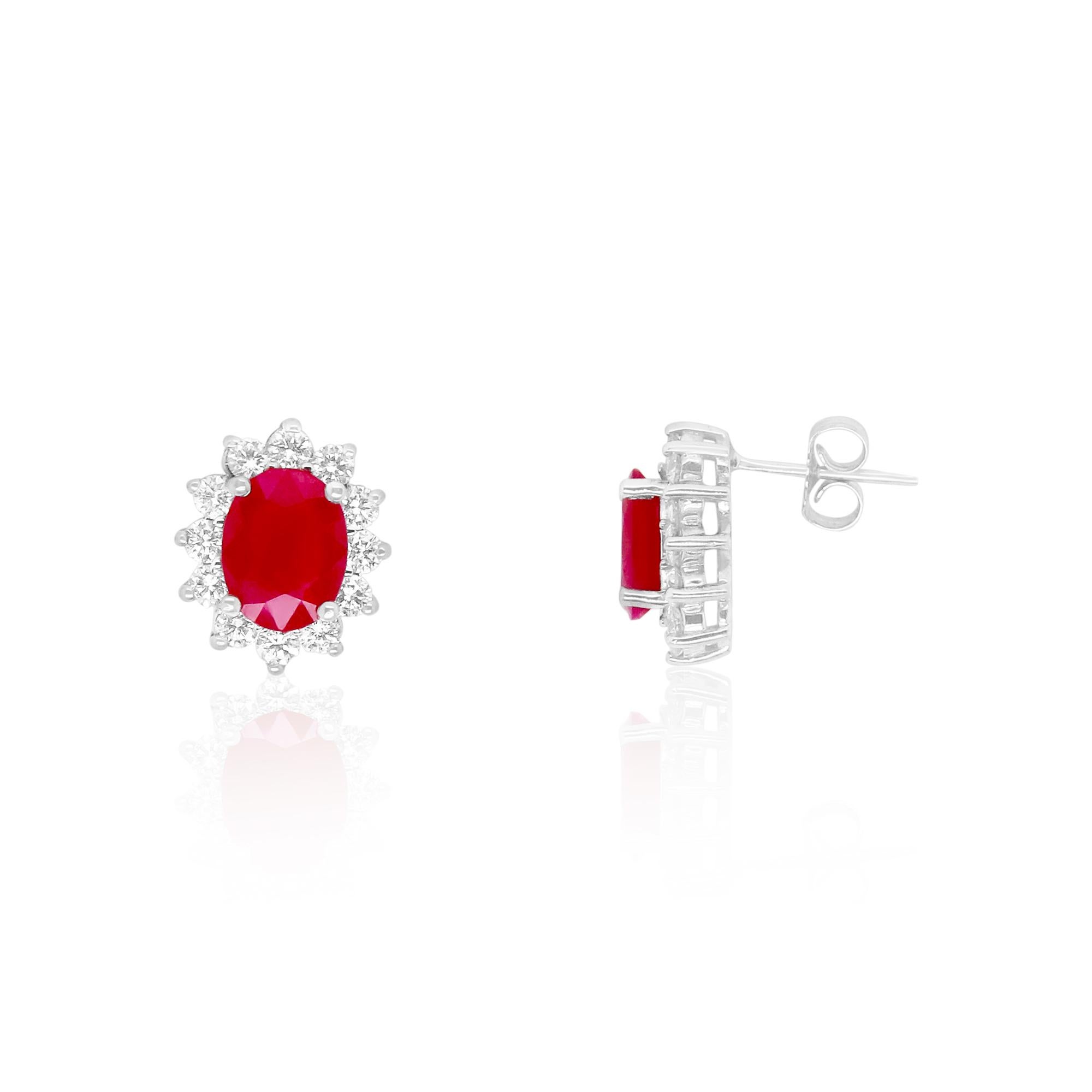 Material: 14k White Gold 
Stone Details: 2 Oval Rubies at 2.75 Carats Total - Measuring 8 x 6mm
24 Brilliant Round White Diamonds at 0.92 Carats. Clarity: SI / Color: H-I

Fine one-of-a kind craftsmanship meets incredible quality in this