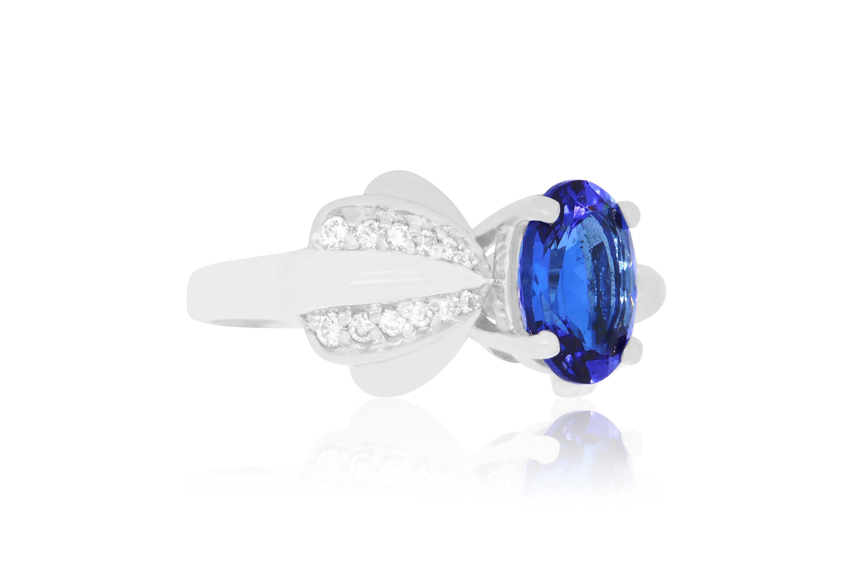 A beautiful 2.75 Carat Oval Shaped Tanzanite is perfectly set in a 14K white gold bow design. Surrounded by 24 dazzling round white diamonds totaling 0.25 Carats, this piece is a unique and chic look!

Material: 14k White Gold
Gemstones: 1 Oval