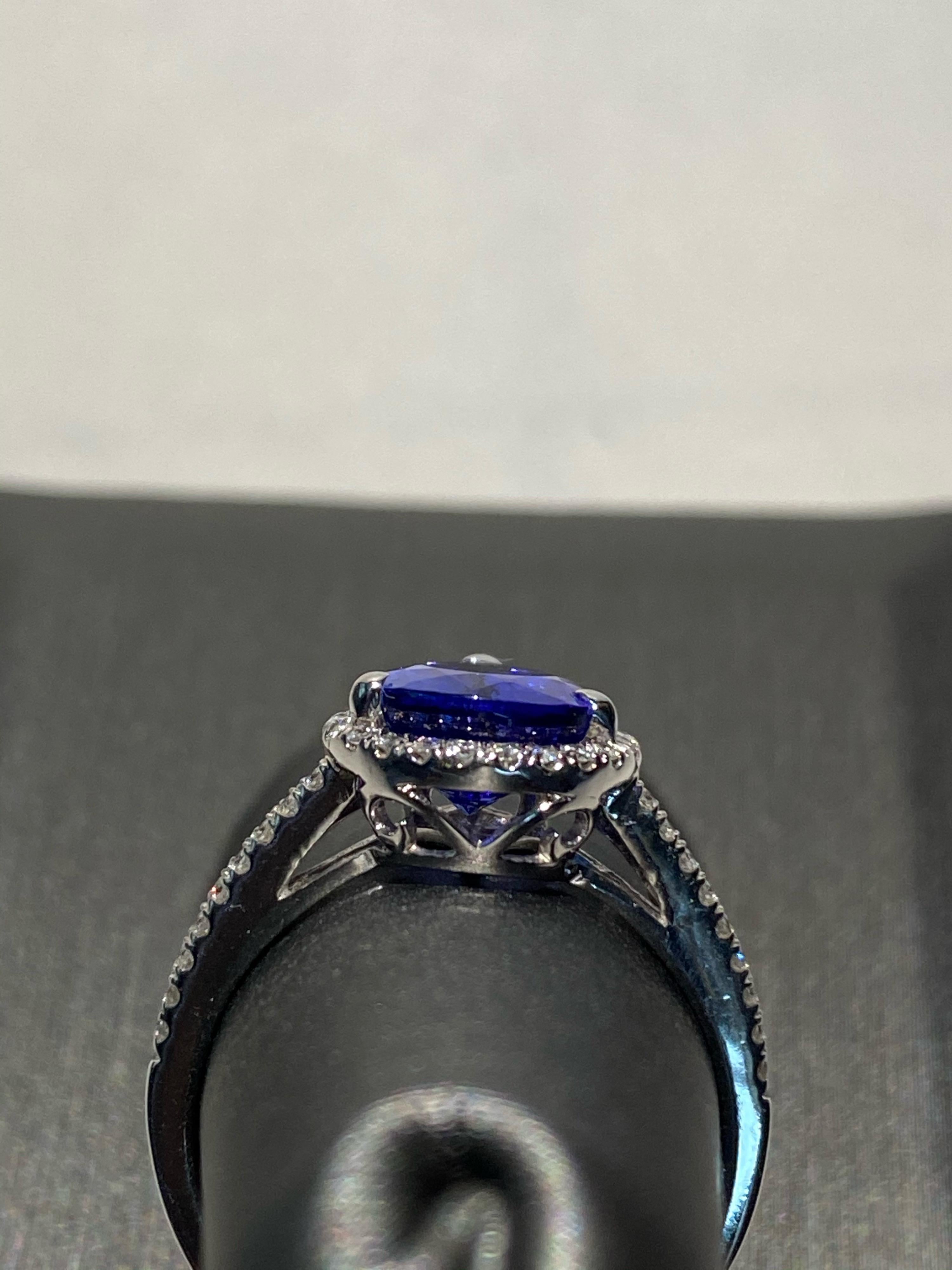 Artisan 2.75 Carat Pear Shaped Tanzanite Diamond Halo Ring For Sale