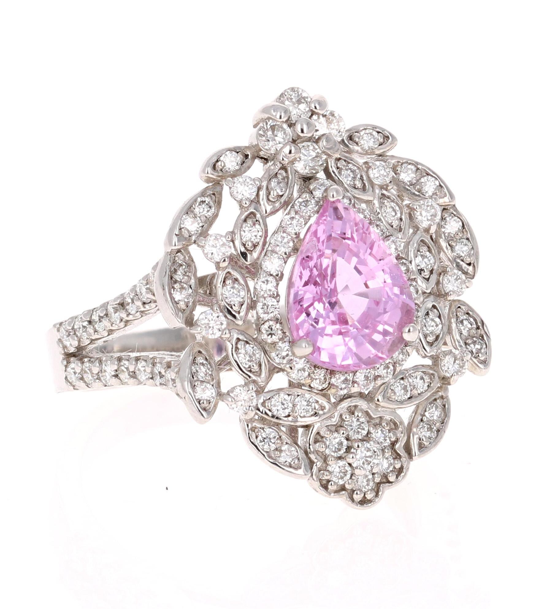 Gorgeous Pink Sapphire Diamond Ring with a beautiful vintage setting! 

The center Pear Cut Pink Sapphire is 1.92 Carats surrounded by 100 Round Cut Diamonds weighing 0.83 Carats. The total carat weight of the ring is 2.75 Carats. 
It is beautifully