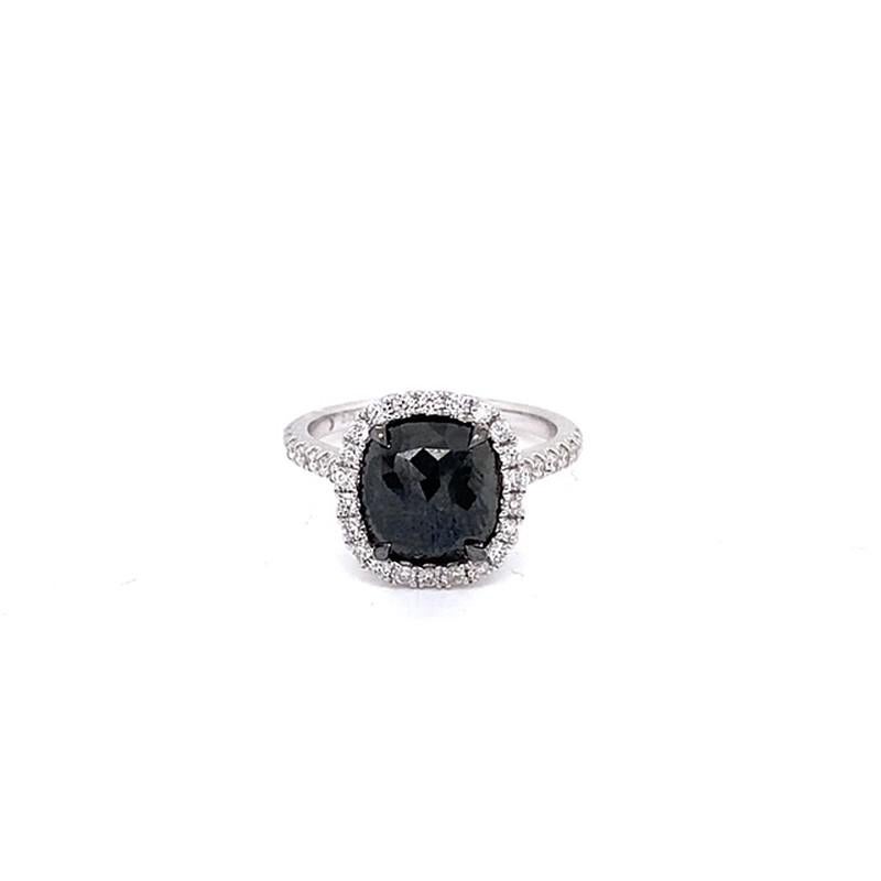 This stunning ring showcases a beautiful 2.75 carat Rose Cut Cushion Black Diamond, with a diamond halo set in 18 karat white gold. 
Total diamond weight (not including center stone) = 0.43 carats. Ring size is 6 1/2.
