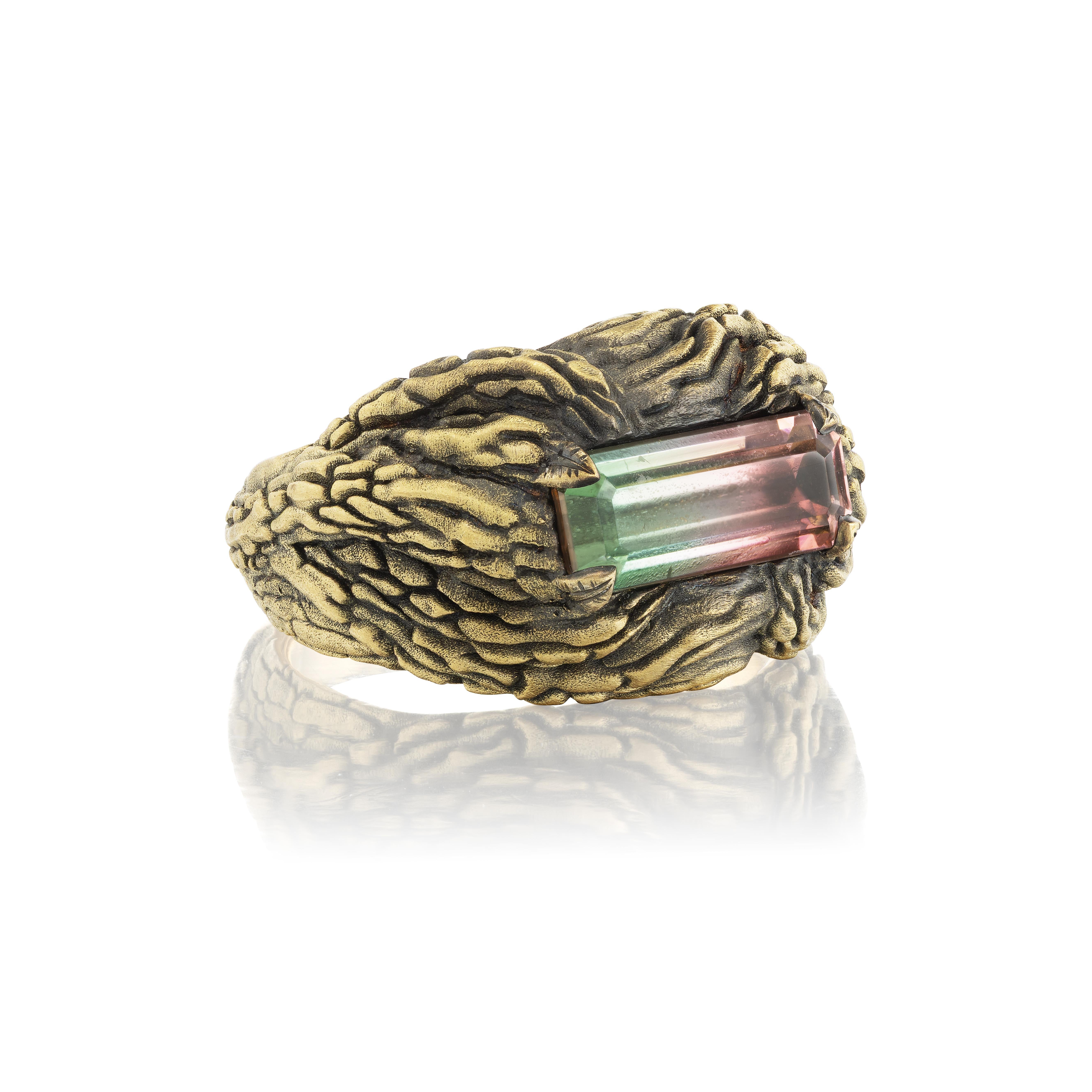 This one-of-a-kind ring from the designer's Sovereignty collection boasts a 2.75-carat untreated watermelon tourmaline from Afghanistan. The hefty 18K yellow gold setting has been carved to look like bark, then blackened for enhanced contrast. The