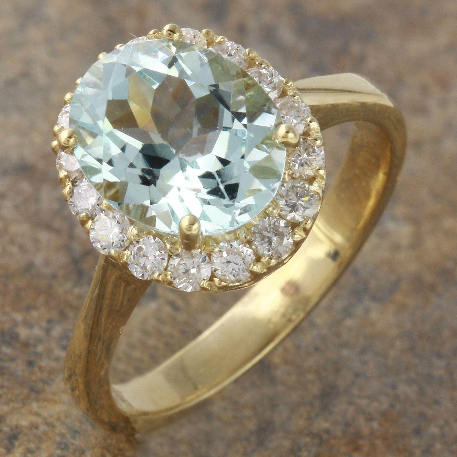 2.75 Carats Exquisite Natural Aquamarine and Diamond 14K Solid Yellow Gold Ring

Suggested Replacement Value: 5,600.00

Total Natural Aquamarine Weight is: 2.10 Carats (Heated)

Aquamarine Measures: 9.54 x 7.10mm

Natural Round Diamonds Weight: .65