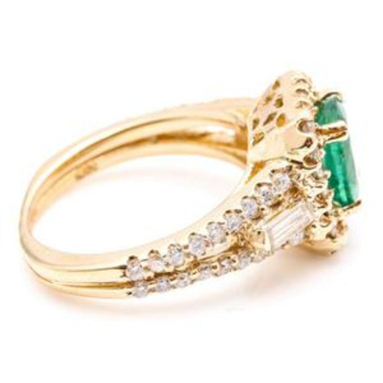 2.75 Carats Natural Emerald and Diamond 14K Solid Yellow Gold Ring

Total Natural Green Emerald Weight is: Approx. 1.60 Carats (transparent)

Emerald Measures: Approx. 8 x 6mm

Emerald Treatment: Oiling

Total Natural Round & Baguette Diamonds