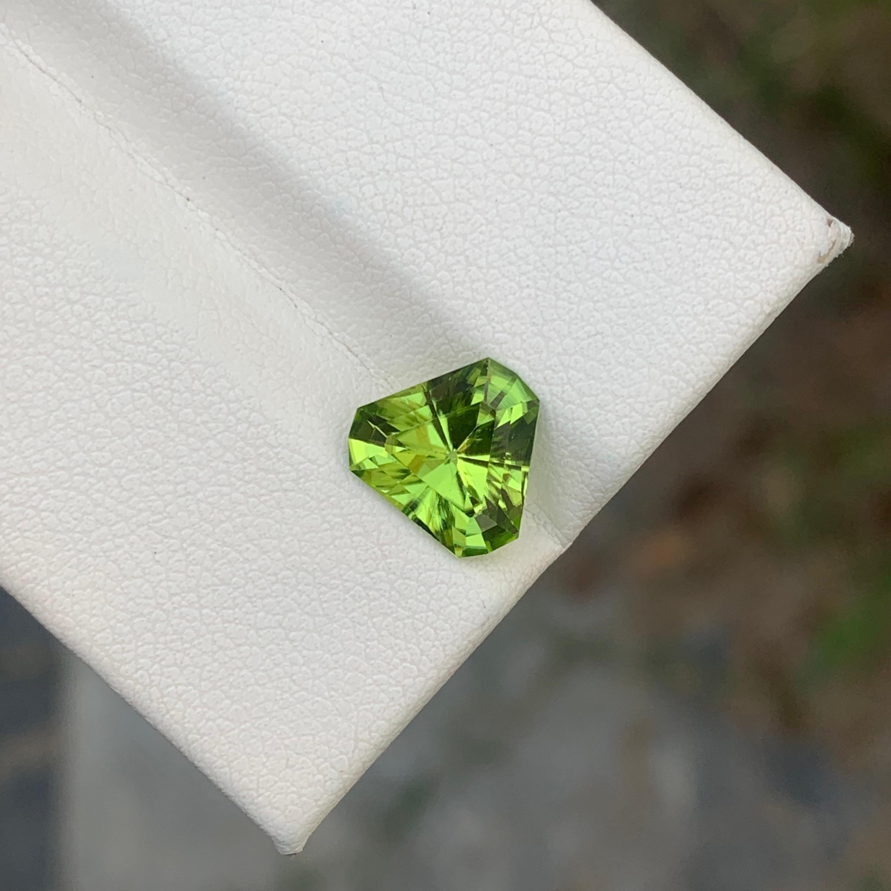 Loose Peridot
Weight: 2.75 Carats 
Dimension: 9.1x9.1x5 Mm
Origin: Pakistan
Shape: Trillion 
Color: Green
Certificate: On Demand 
Peridot is a captivating and unique gemstone known for its vibrant green color and rich history. This gem, with its