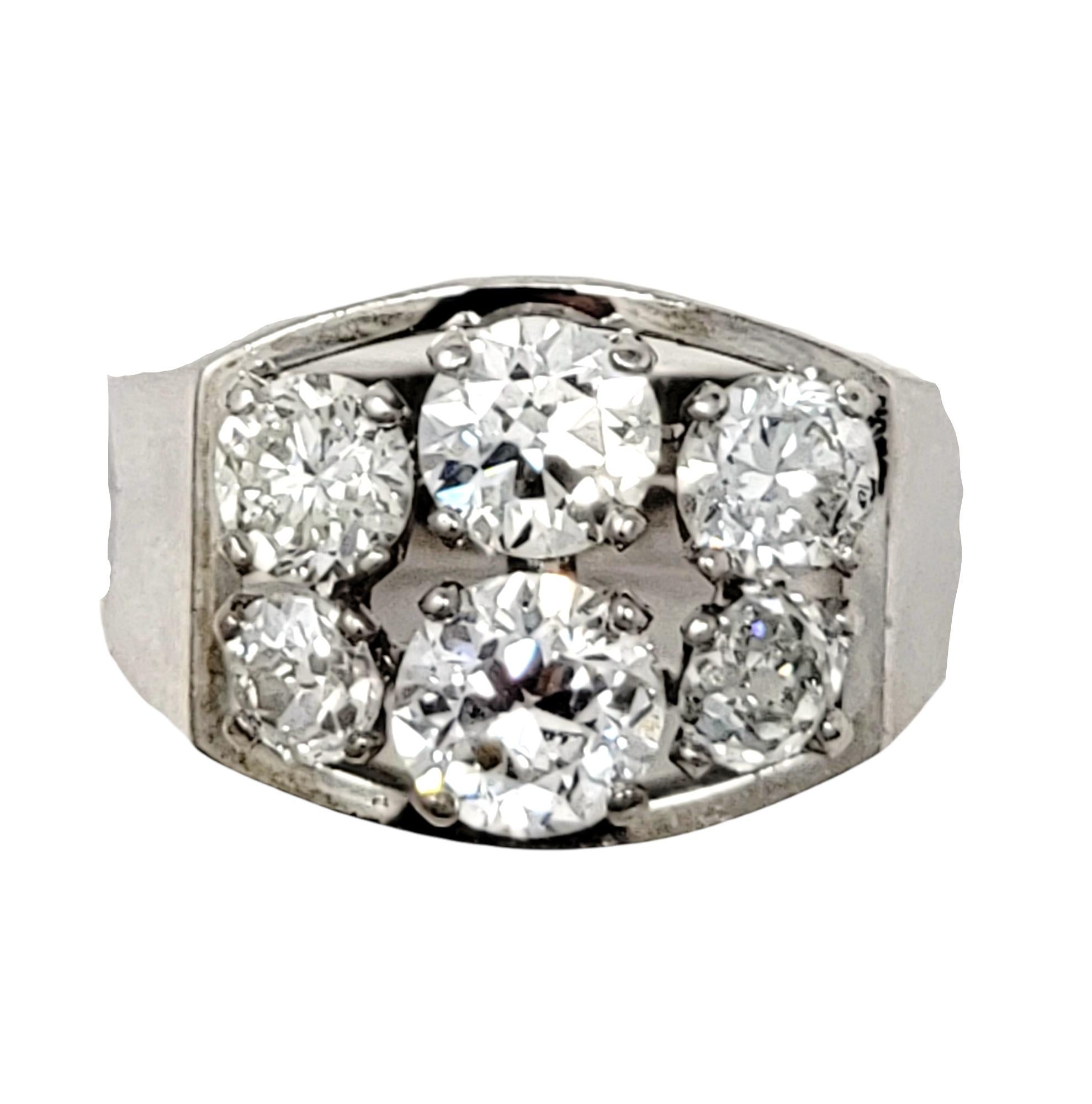 Ring size: 6.75

Bold and brilliant six stone diamond band ring. This incredible and unique piece features 4 variations of round diamonds; Semi-Modern, Old Mine, Old European and Round Brilliant. The 2.75 carats of glittering natural diamonds are