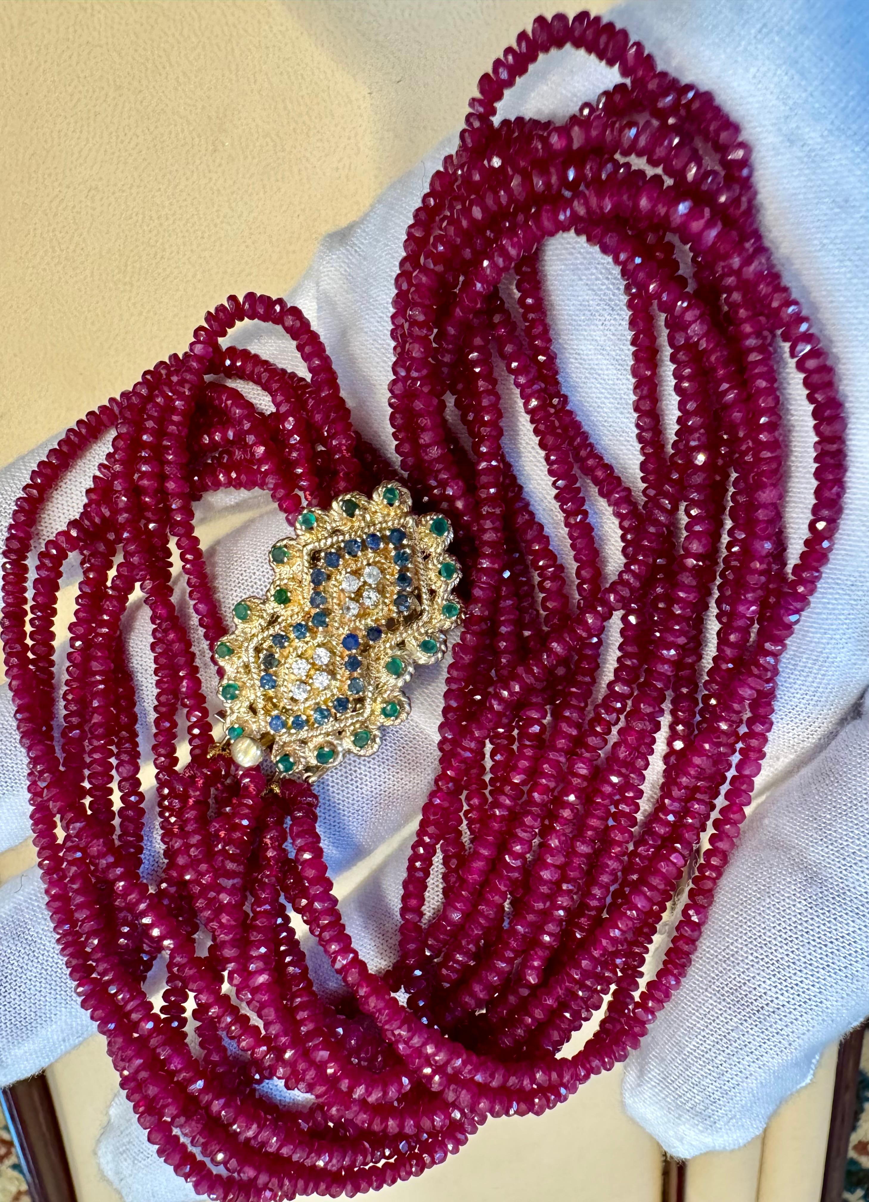 Approximately 275 Ct , 8 Layer Natural  Ruby  Bead Necklace 14 Karat Yellow Gold Diamond Clasp which has small emerald sapphires and diamonds.
This spectacular Necklace   consisting of approximately 275 Ct   of  Fine  natural beads of Ruby
A