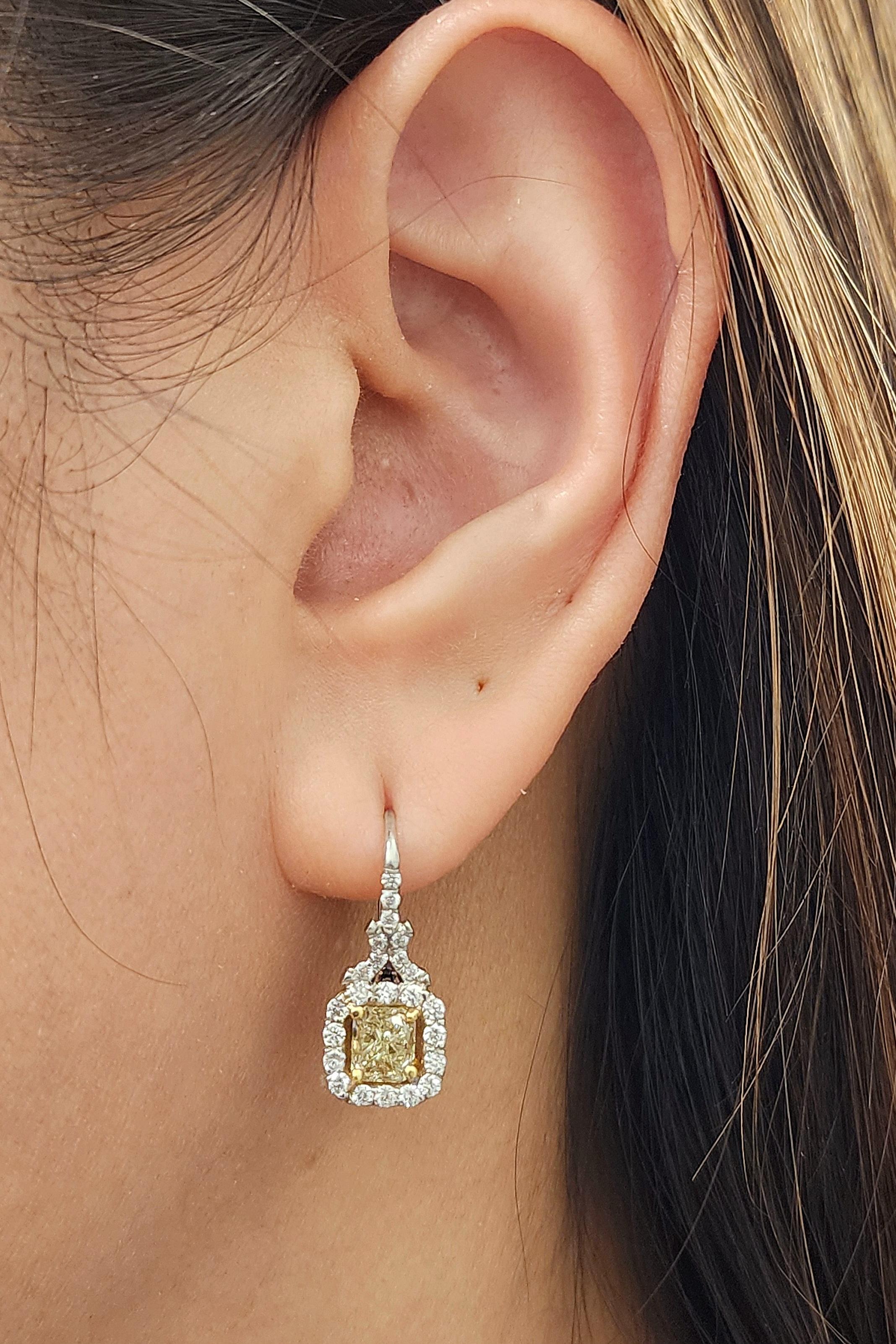 Here we have a stunning pair of natural yellow diamond earrings. The earrings feature two natural yellow diamonds weighing 2.08 ct. and are surrounded by diamonds weighing 0.67 ct set in platinum. A beautiful addition to any wardrobe.