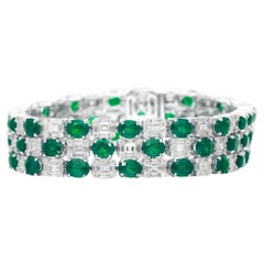Bracciale intricato con diamante verde smeraldo da 27,50 carati