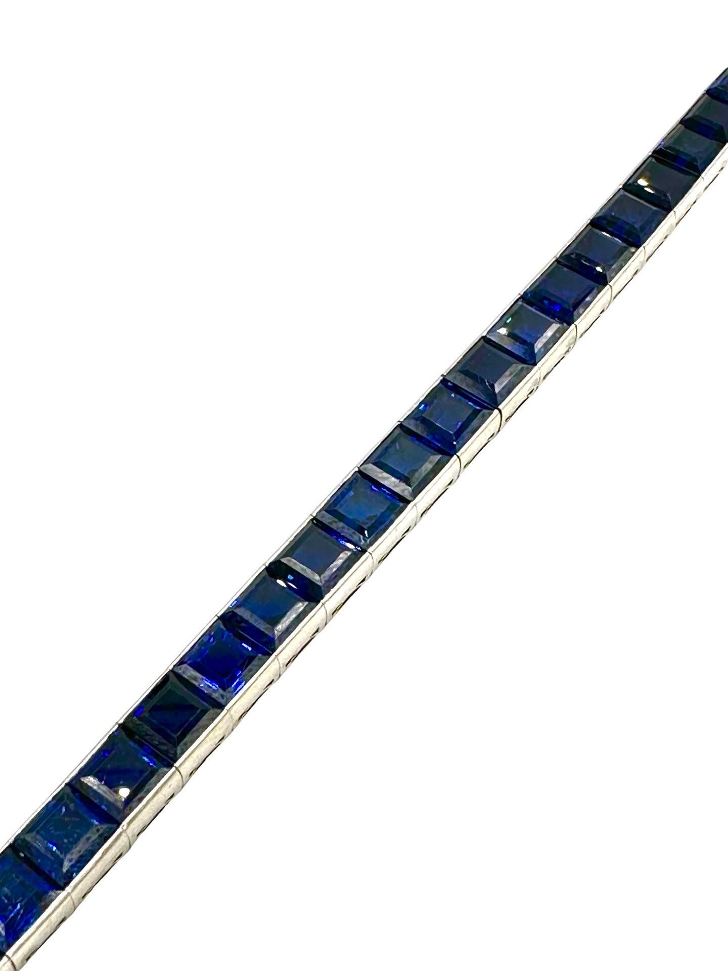 An absolutely stunning natural Sapphire line bracelet.  All the Sapphires are square cut, matched beautifully with a rich blue tone.  Each sapphire is over 1.00 carat, all set in platinum.  There is 27.50 carats total in the bracelet which features