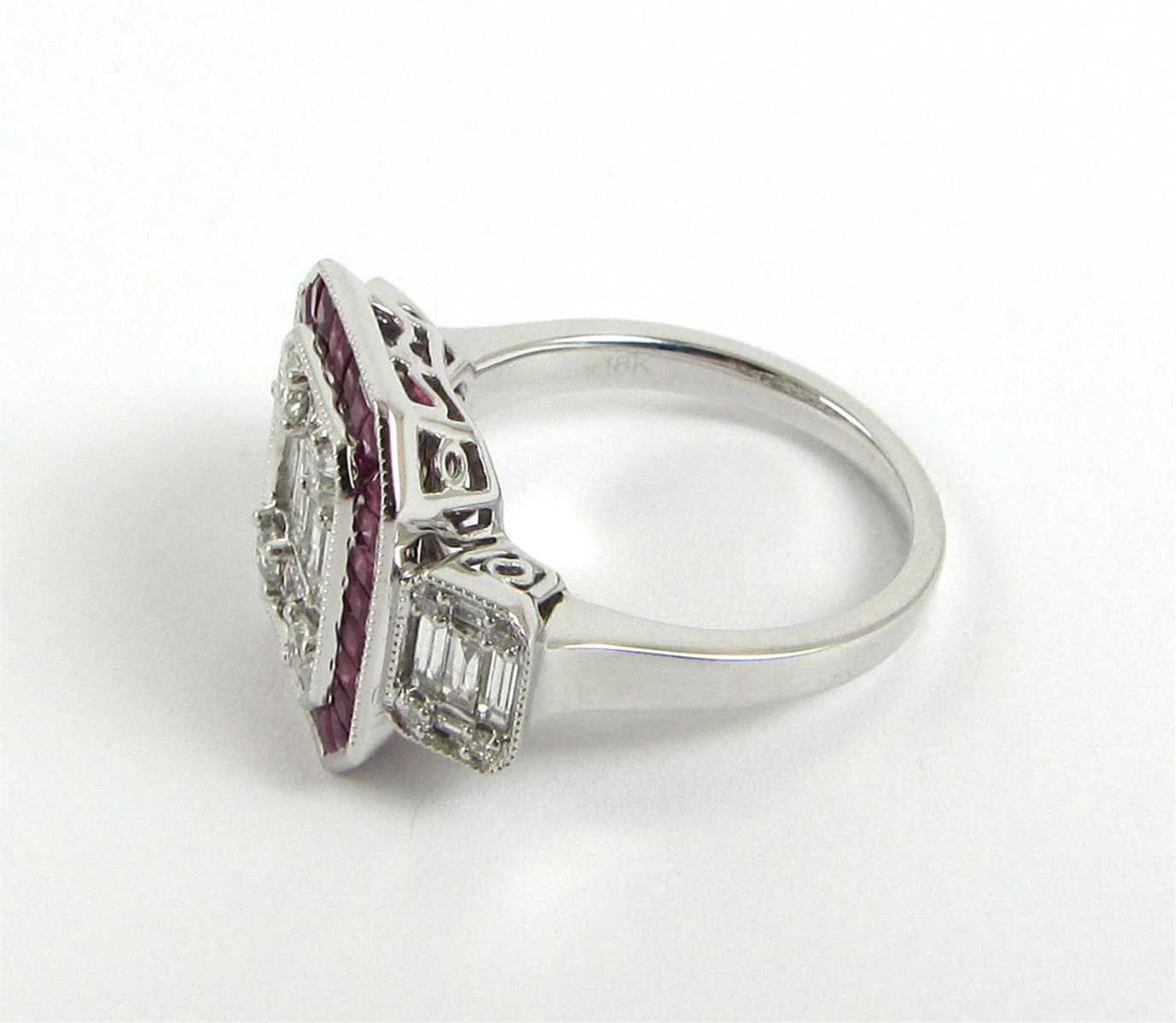 The Following Items we are offering is a Rare Important Radiant 18KT WHITE GOLD LARGE DIAMOND AND RUBY VENETIAN  ART DECO STYLE RING. Ring is comprised with a Large Finely Set Sparkling Baguette Clusters of Faceted Diamonds surrounded with a Halo of