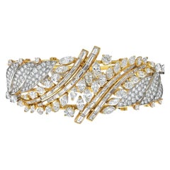 Bracciale in oro giallo e platino con diamanti rotondi e taglio baguette da 27,50 carati