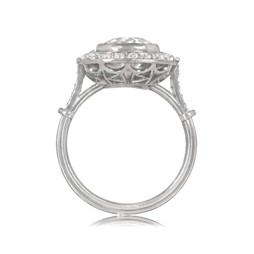 Diamond halo engagement ring with antique cushion cut diamond weighing 2.75 carats, K color, and VS1 clarity. Old European cut diamonds and carre cut diamonds form the halo and shoulders. The platinum ring has a triple-wire shank and openwork