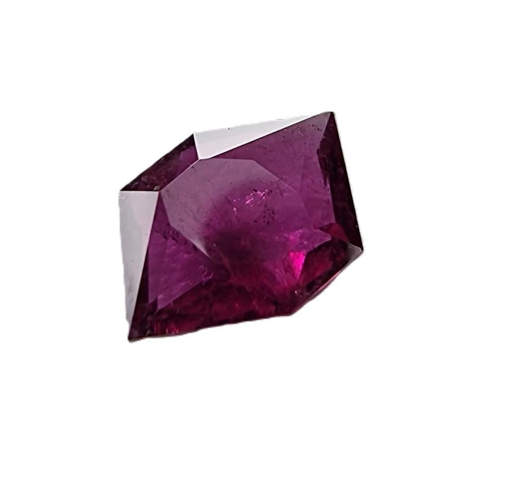 Elevate your jewelry creations with the unique and mesmerizing beauty of our 2.75-carat Custom Cut Pinkish Red Rubellite Tourmaline Loose Gemstone. 

Gemstone Details:
Carat Weight: 2.75 carats
Shape: Custom Cut (Four-Sided with Blunt Tip on Top