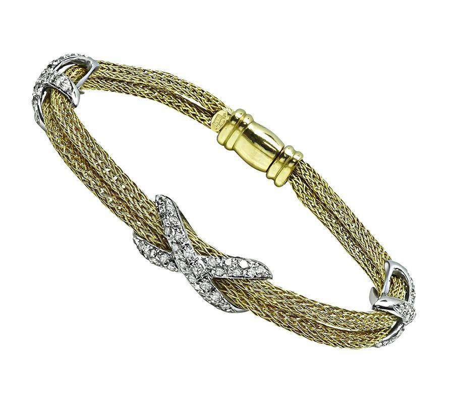 This is an elegant 18k yellow and white gold necklace and bracelet set. The set features sparkling round cut diamonds that weigh approximately 2.75ct. The color of these diamonds is H with VS clarity. The necklace measures 8.5mm in width at the