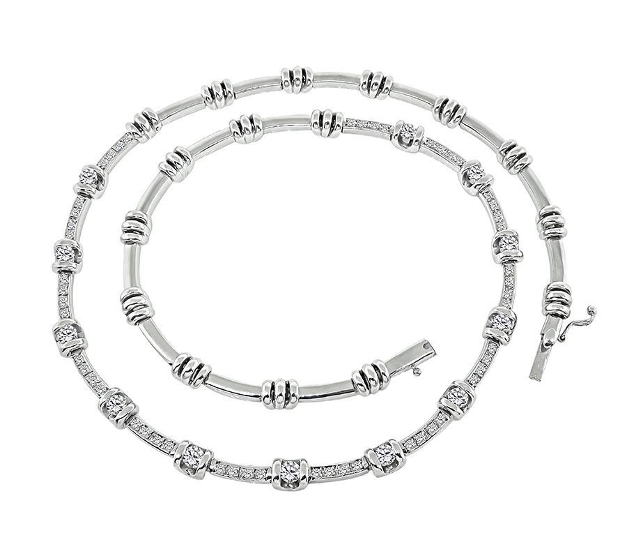 This is a gorgeous 18k white gold necklace. The necklace is set with sparkling round cut diamonds that weigh approximately 2.75ct. The color of these diamonds is F-G with VS clarity. The necklace measures 5mm in width at the widest base and 16 3/4